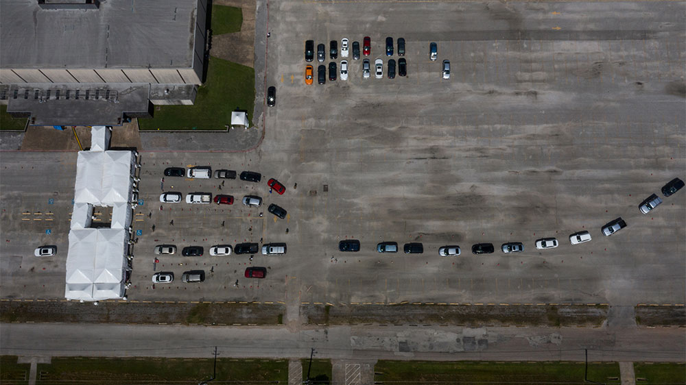 Residents line-up in their vehicles to be tested amid the global outbreak of the coronavirus disease (COVID-19) in Houston, Texas, US