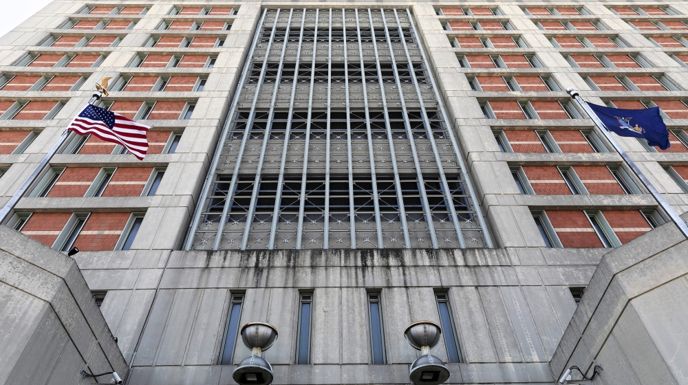 Flags fly in front of the Metropolitan Detention Center, Monday, July 6, 2020, in the Brooklyn borough of New York. Jeffrey Epstein's longtime confidante Ghislaine Maxwell has been transferred to New 
