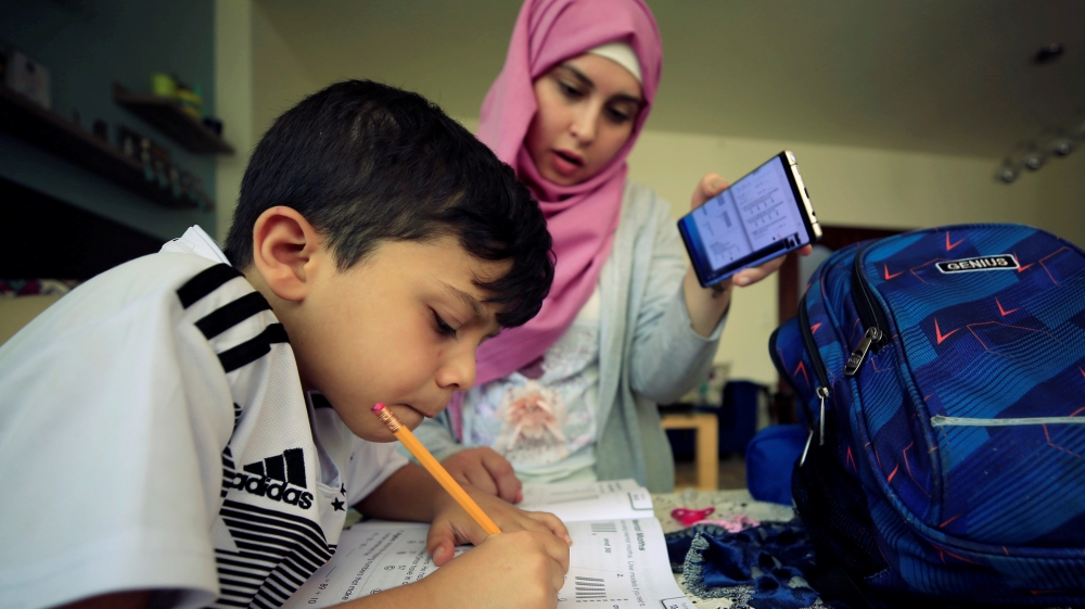 A young student studies online at home in Sidon, Lebanon