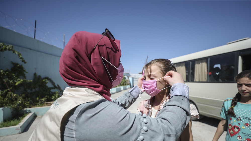 Volunteer hairdressers in Jarabulus cheer the Orphan girls