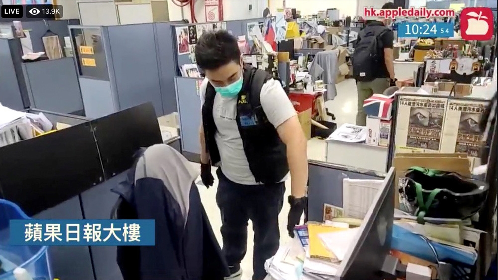 Hong Kong police raided the offices of Next Media and Apple Daily in Hong Kong after arresting the group’s founder Jimmy Lai under the territory’s National Security Law [Apple Daily via Reuters]