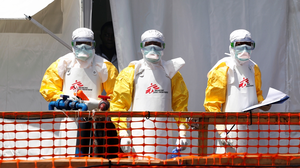 Health workers dressed in protective suits are seen at the newly constructed MSF(Doctors Without Borders) Ebola treatment centre in Goma, Democratic Republic of Congo