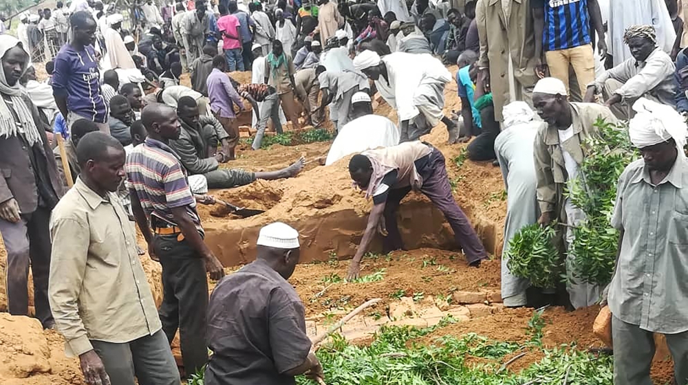 Residents dig a mass grave for victims of an attack that left over 60 dead in the village of Masteri in west Darfur, Sudan Monday, July 27, 2020. A recent surge of violence in Darfur, the war-scarred