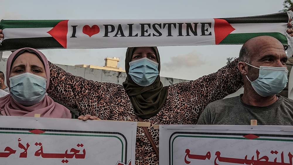 epa08671327 Palestinians attend a protest against the agreement between Israel and the United Arab Emirates and Bahrain, in Gaza city, 15 September 2020. Many are against the agreement between the UAE