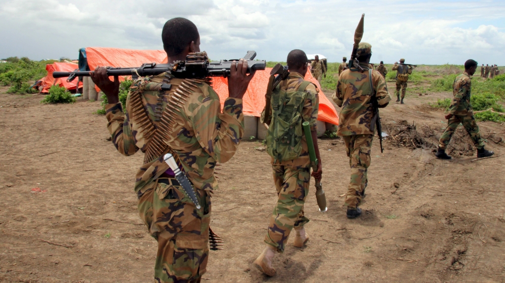 Jubbaland forces carry their ammunitions during a security patrol against Islamist al Shabaab militants in Bulagaduud town, north of Kismayu