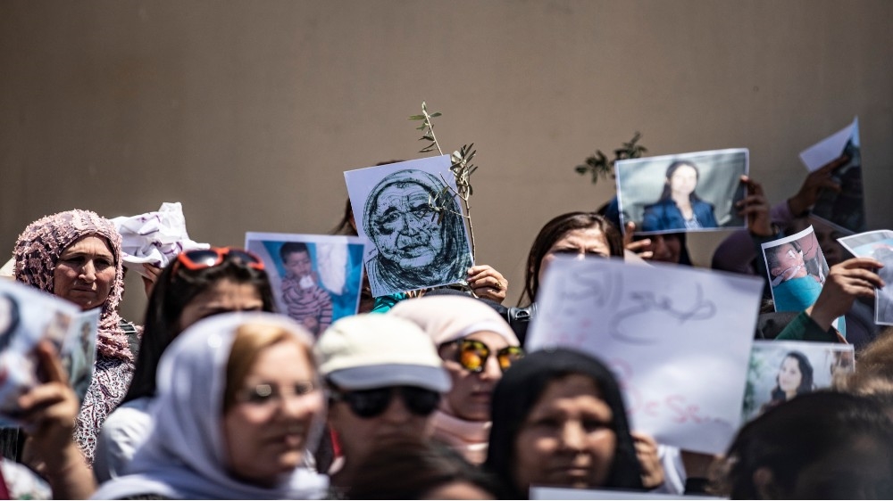 File: Displaced Syrians from the northern city of Afrin protest violations by local Turkish-backed factions