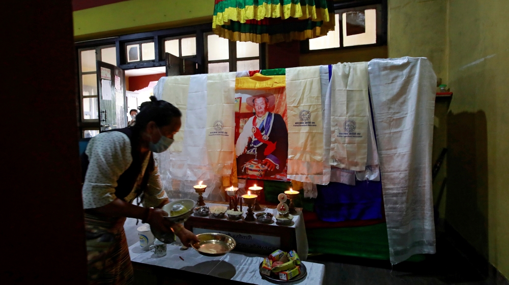 A family member places an offering near the body of Ang Rita Sherpa, also known as the “snow leopard” for his climbing skills, who climbed Everest 10 times without the use of supplement oxygen, inside
