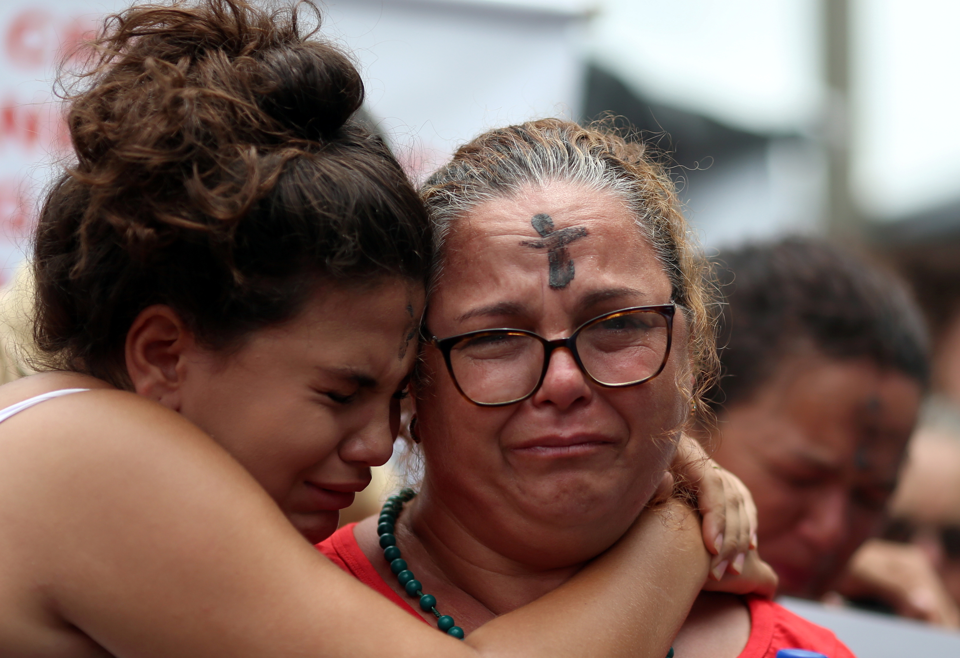Relatives of a victim react during a ceremony last January to mark one year of the disaster of the tailings dam owned by Brazilian mining company Vale SA in Brumadinho, Minas Gerais state, Brazil