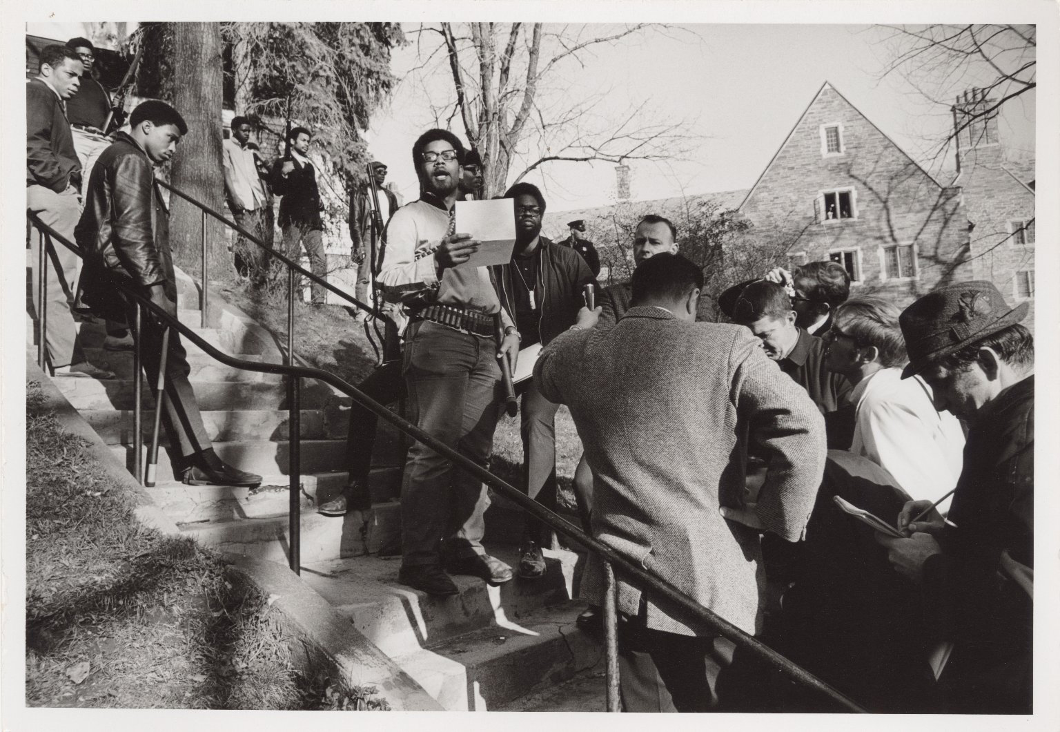 April 20, 1969: Cornell University student leader Eric Evans reads a statement after members of the Afro-American Society occupied Willard Straight Hall to protest against the university's perceived racism [Photo courtesy of Division of Rare and Manuscript Collections, Cornell University]