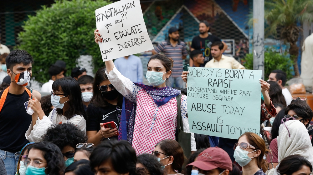 People carry signs against a gang rape that occurred along a highway and to condemn violence against women and girls, during a protest in Karachi, Pakistan September 12, 2020. REUTERS/Akhtar Soomro