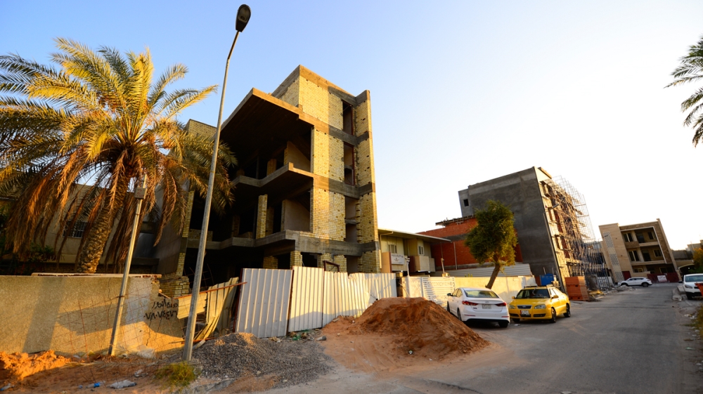 Apartment blocks are popping up across Harthiya, despite regulations that only allow single family dwellings. The addition of new buildings has increased population density and erased part of Baghdad’