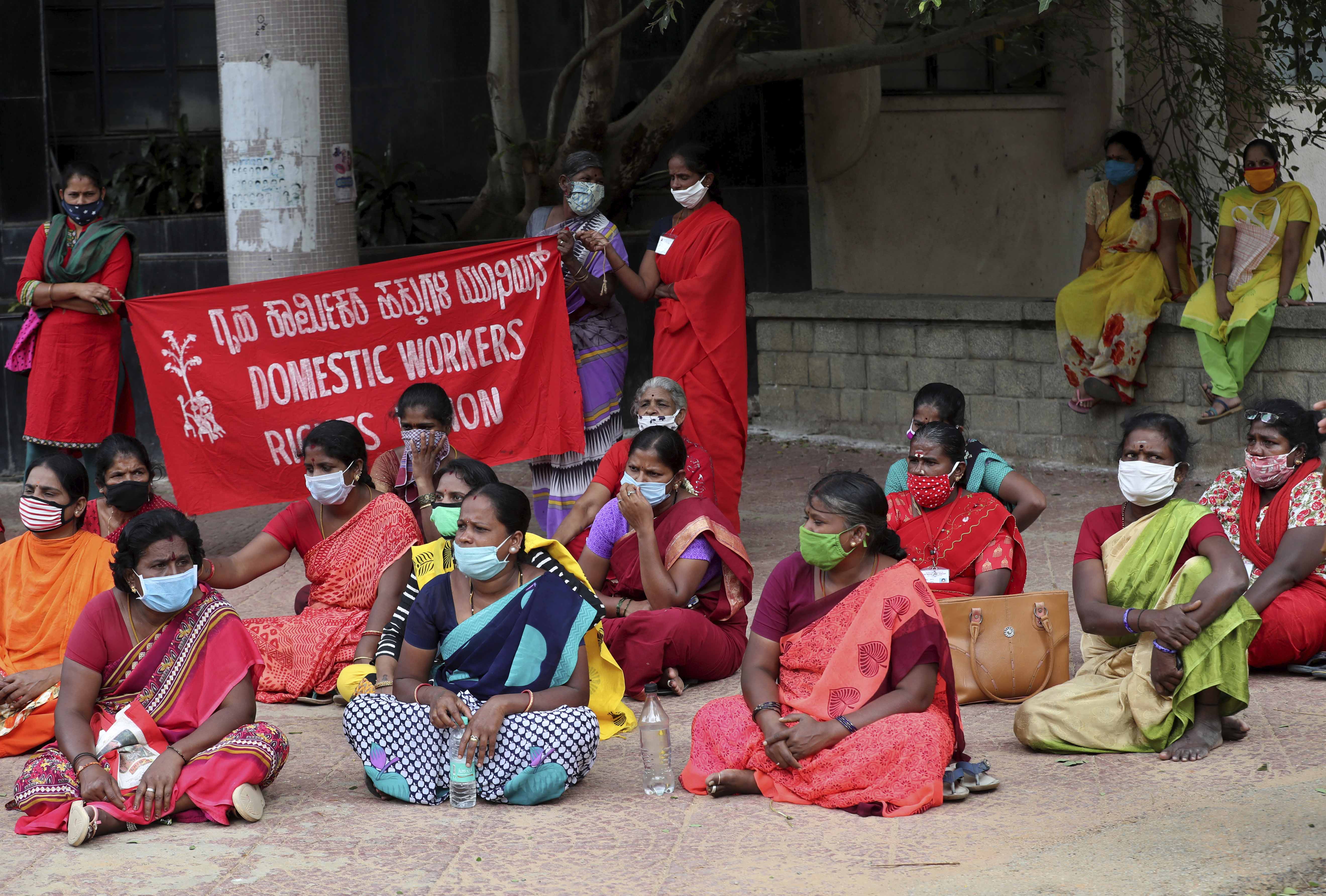 Domestic workers, many of whom have lost their jobs after the coronavirus outbreak, gather for a protest demanding social security from the government in Bengaluru, India on June 15, 2020 [File: AP/Aijaz Rahi]