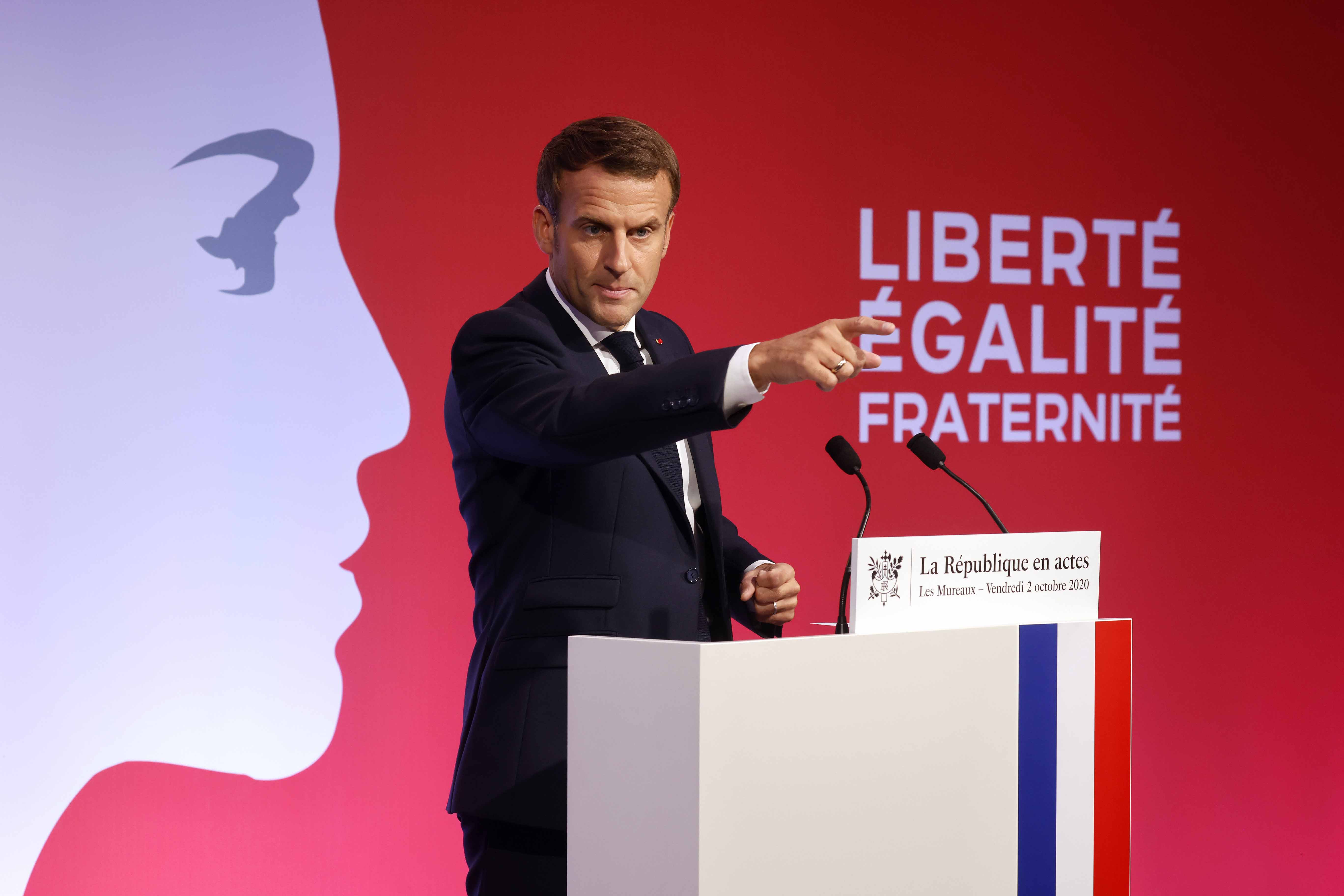 French President Emmanuel Macron presents his strategy to fight what he calls 'separatism' on October 2, 2020 in Les Mureaux, outside Paris [File: Ludovic Marin /Pool via AP]