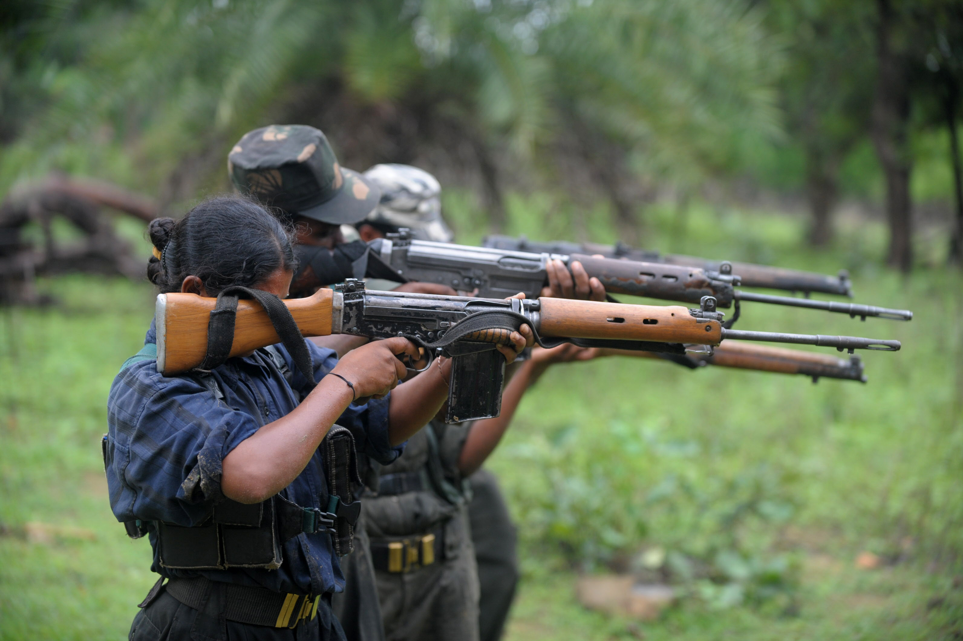 Indian Maoists ready their weapons as they take part in a training camp in a forested area of Bijapur District in the central Indian state of Chhattisgarh on July 8, 2012 [FILE: Noah Seelam/AFP]