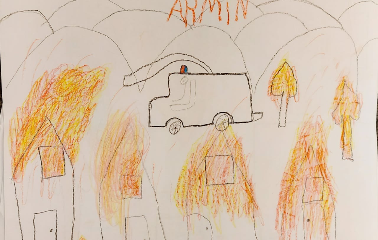 A drawing by a child in Lesbos depicting the fire which raced through the Moira refugee camp in September [Courtesy: MSF]