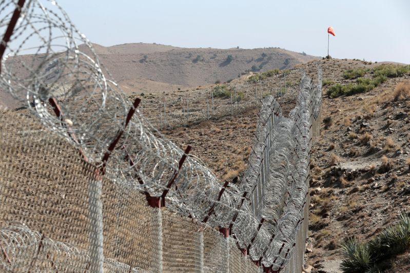 A view of the border fence outside the Kitton outpost on the border with Afghanistan in North Waziristan, Pakistan October 18, 2017 [Caren Firouz/Reuters]