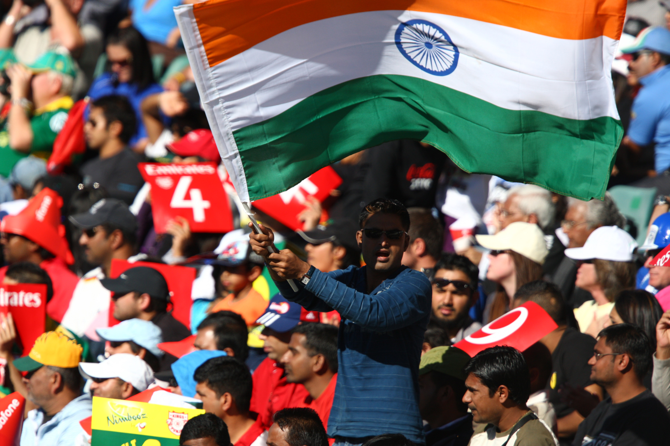 A cricket fan waves an Indian flag during the 2009 Indian Premier League (IPL) T20 cricket match in Johannesburg, South Africa