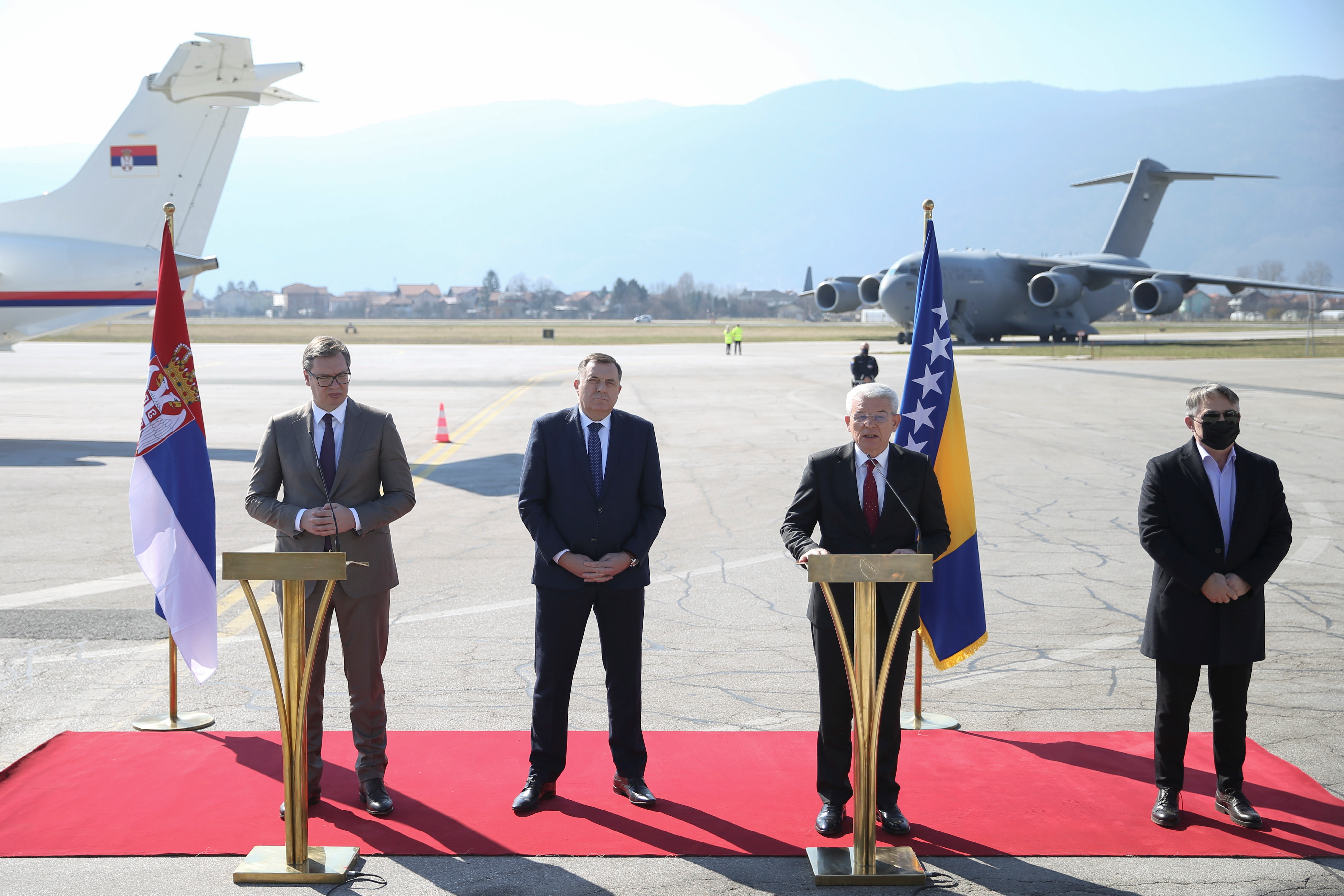 Serbia's President Aleksandar Vučić and Bosnia's members of tripartite presidency Šefik Džaferović, Milorad Dodik and Željko Komšić hold a joint news conference, following the donation of a batch of vaccines against COVID-19 by Serbia at Sarajevo International Airport on March 2, 2021 [Reuters/Dado Ruvić]