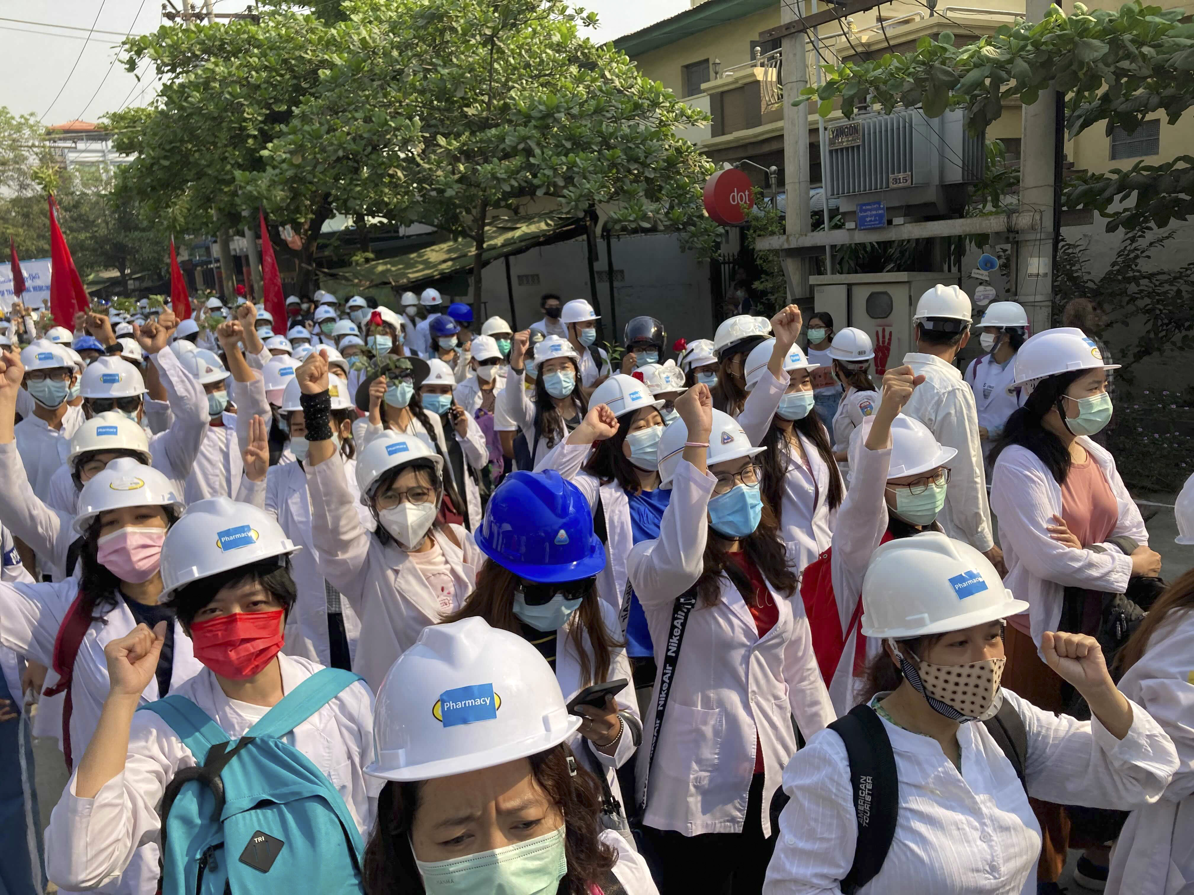 University students march on a main road during a demonstration in Mandalay, Myanmar on March 7, 2021 [AP]