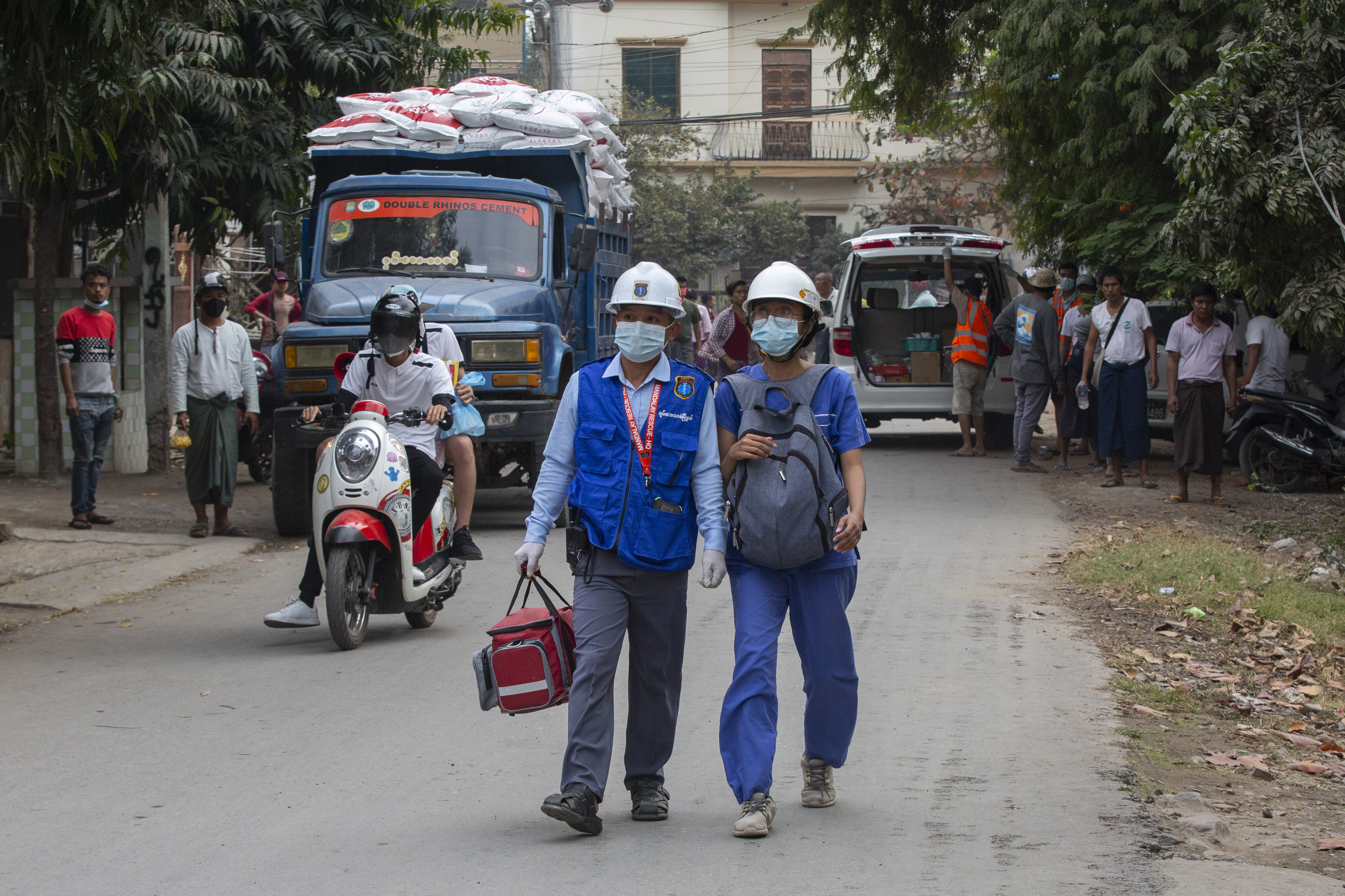 Emergency medical response volunteers in Mandalay on February 20, the day police opened fire on anti-coup protesters in the city, killing two [Al Jazeera]