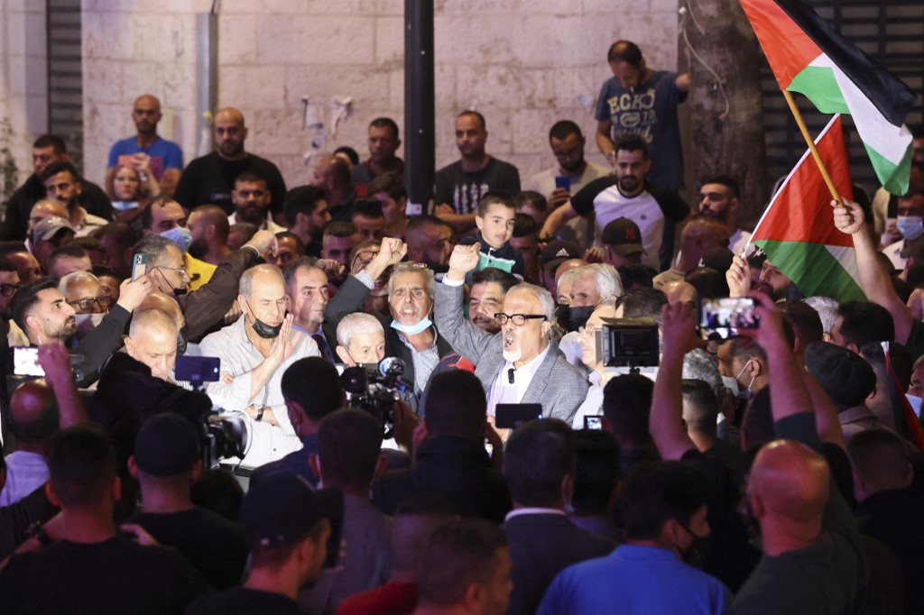 Protesters in Gaza and the West Bank called for the elections to proceed as scheduled - for many it would be their first election [Abbas Momani/AFP]