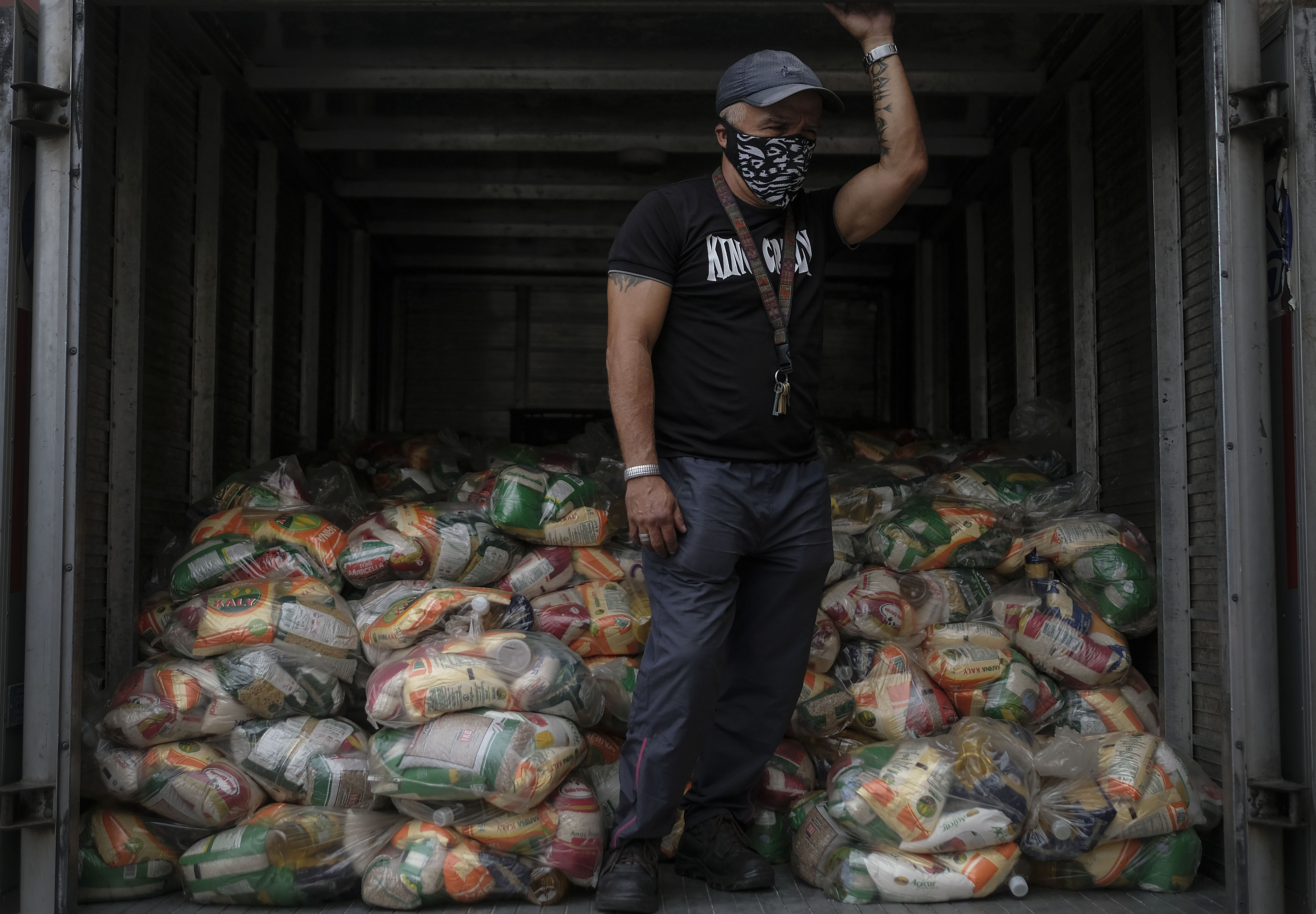 Food assistance bags containing basic food staples, such as pasta, sugar, flour, and kitchen oil, provided through the CLAP government food assistance programme in the Santa Rosalia neighbourhood of Caracas, Venezuela. [Matias Delacroix/AP Photo]