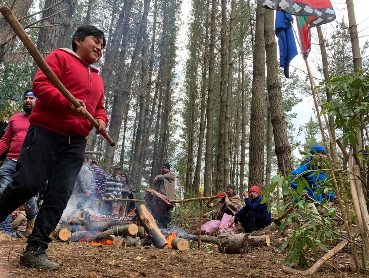 A Mapuche child playing palin, an ancestral game, at a social gathering of Mapuche communities intended to strengthen bonds between them