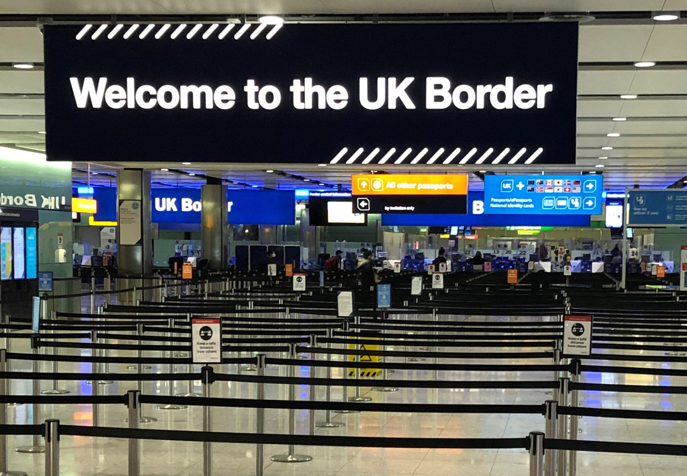 A UK border sign welcomes passengers on arrival at Heathrow airport