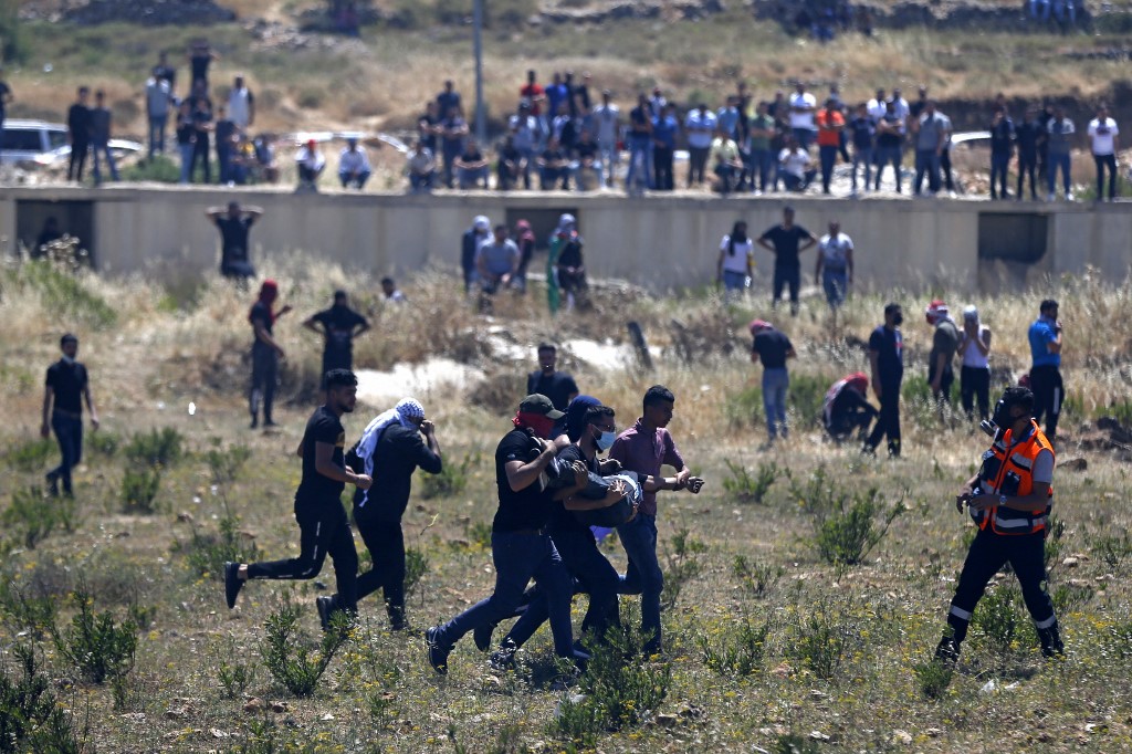 Palestinians protesting against Israel's occupation near Beit El and Ramallah [Abbas Momani/AFP]