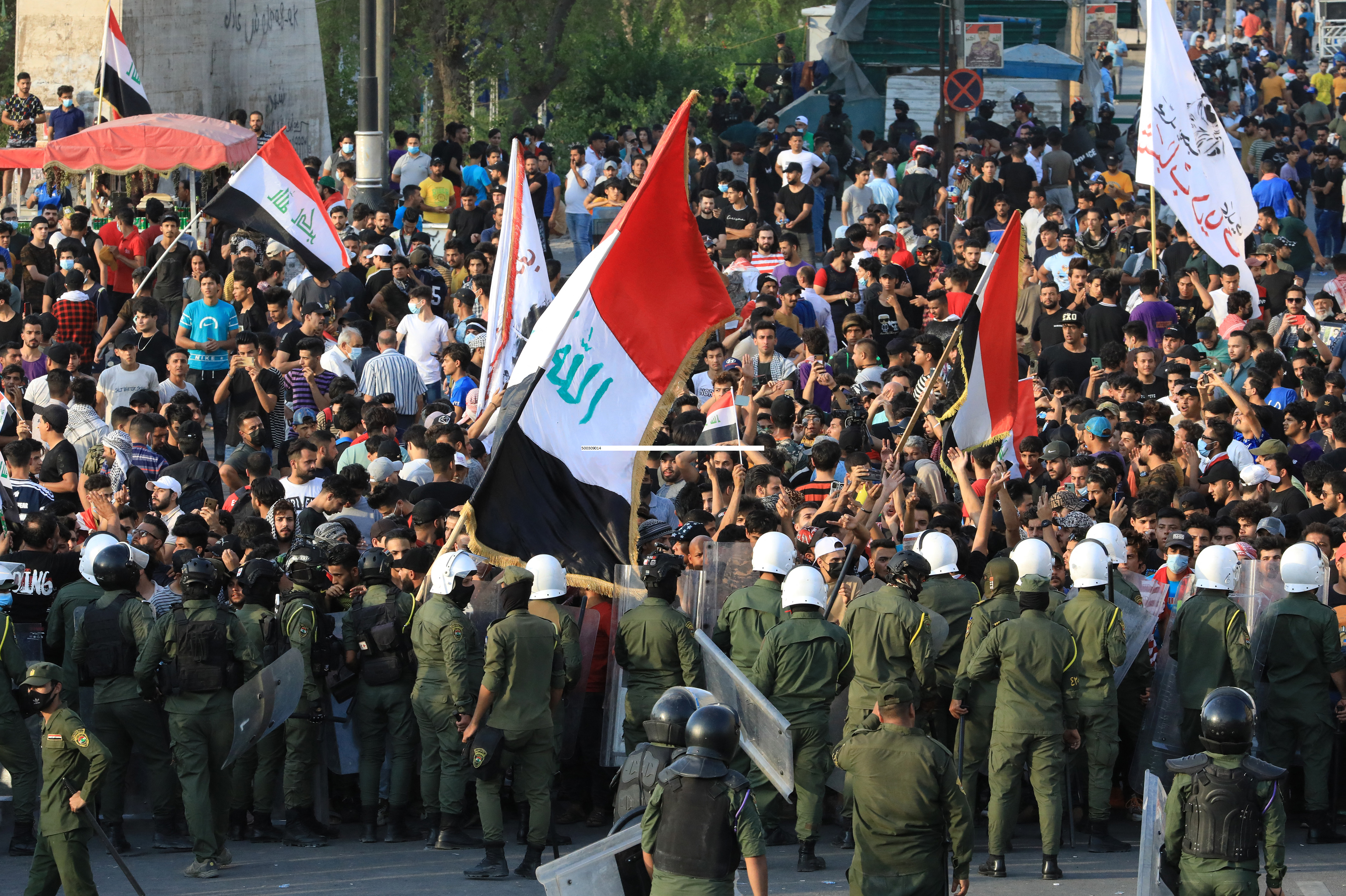 Some older men and women also took to the streets in a show of support [Ahmad Al-Rubaye/AFP]