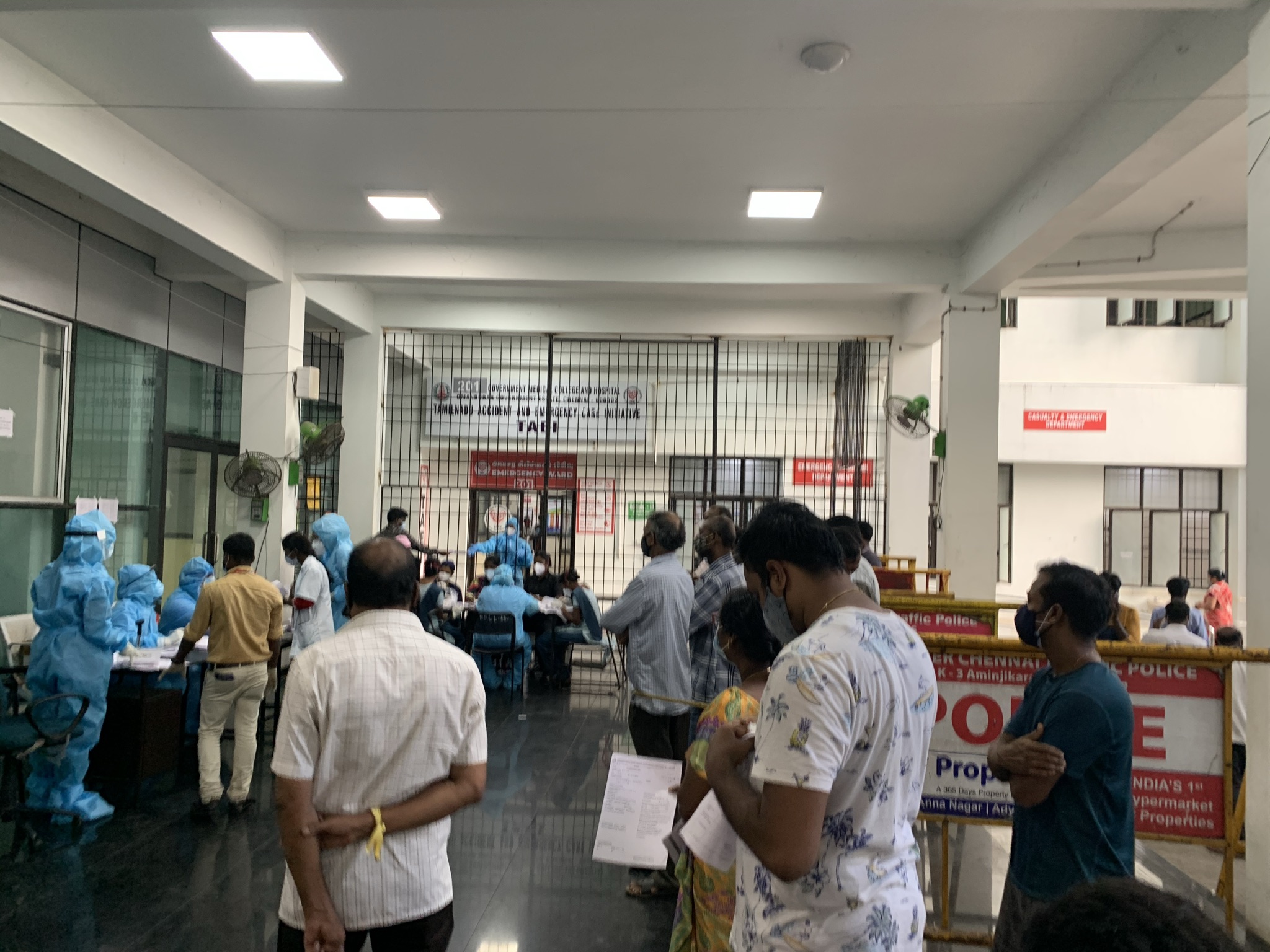 Family members wait outside the Tamil Nadu Multi-Specialty Government Hospital in Chennai [Kunal Shankar/Al Jazeera]