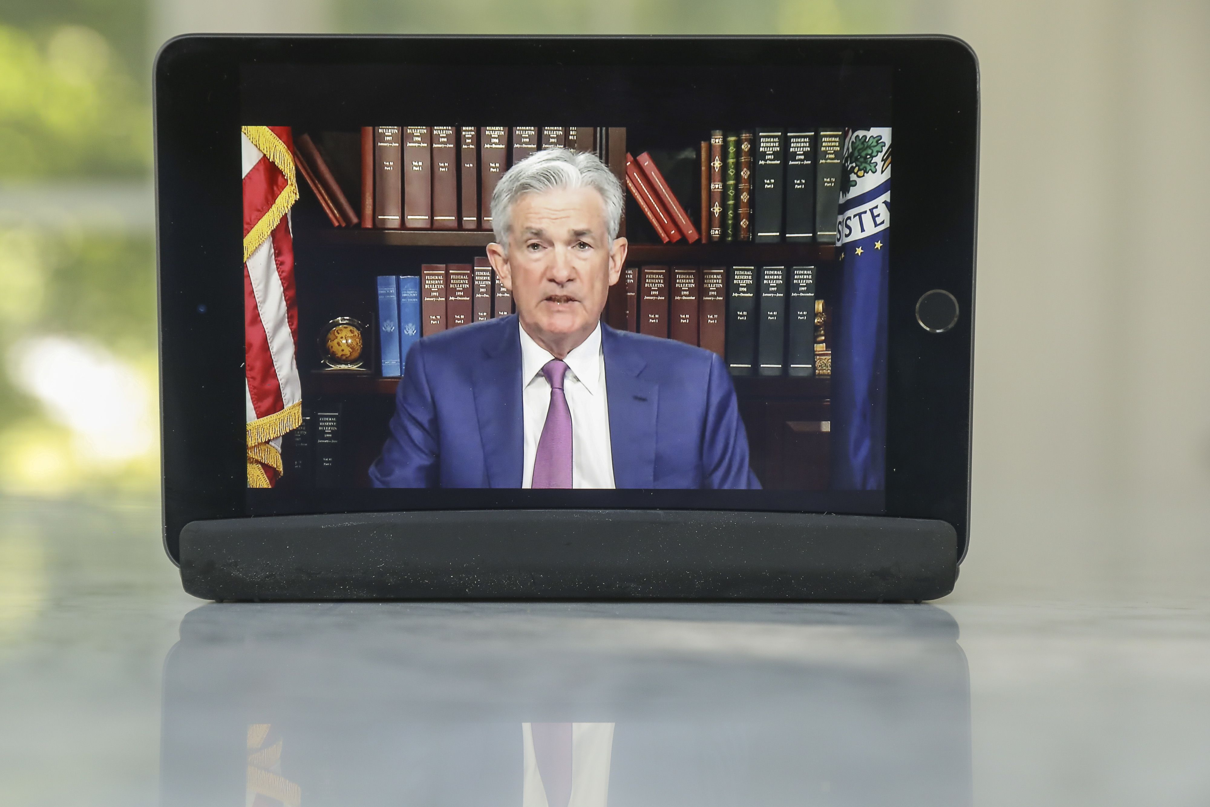 United States Federal Reserve Chairman Jerome Powell delivered his remarks virtually Friday after a surge in COVID-19 cases near the planned symposium site in Jackson Hole, Wyoming forced organisers to scrap in-person plans [File: Daniel Acker/Bloomberg]
