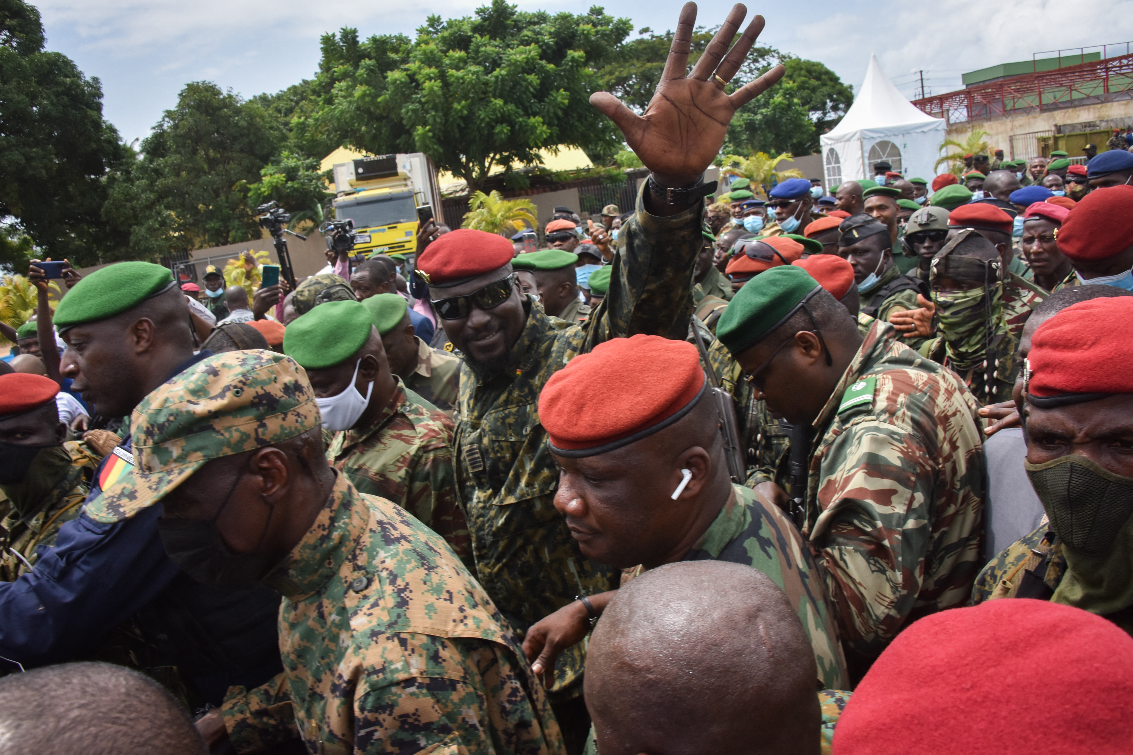 Lieutenant Colonel Mamady Doumbouya, head of the Army special forces and coup leader, waves to the crowd as he arrives at the Palace of the People in Conakry on September 6, 2021