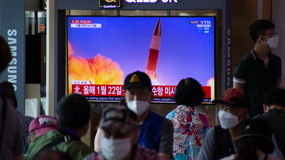 People watch a television showing breaking news at station in Seoul, South Korea, 15 September 2021.