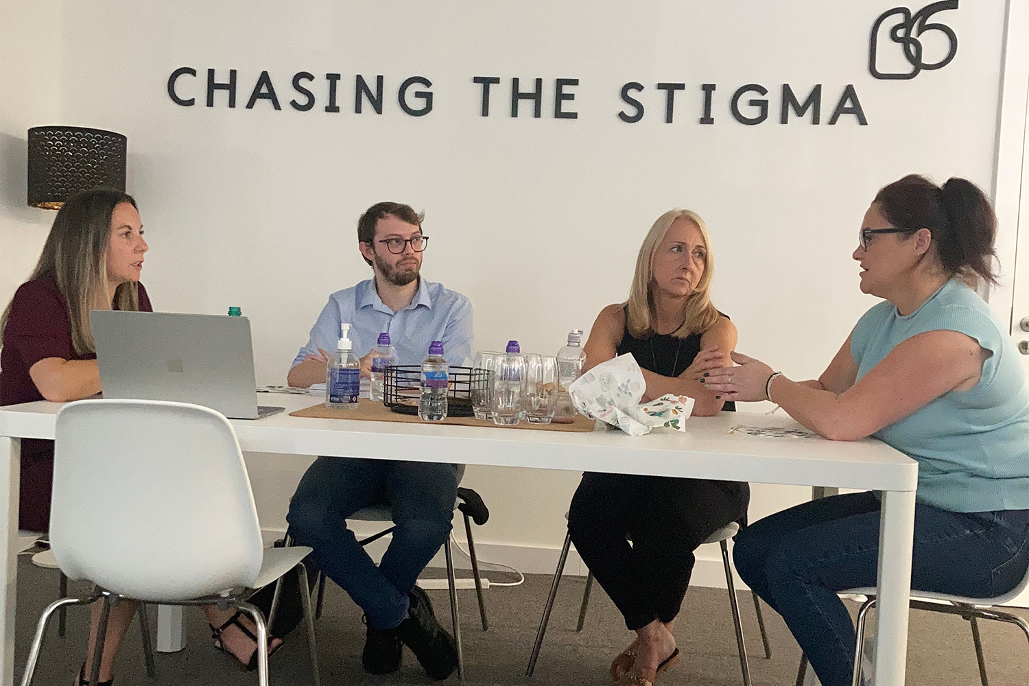 Rachel Coogan, far left, training Ambassadors of Hope at the Chasing the Stigma offices in Liverpool [Jessica Baldwin/Al Jazeera]