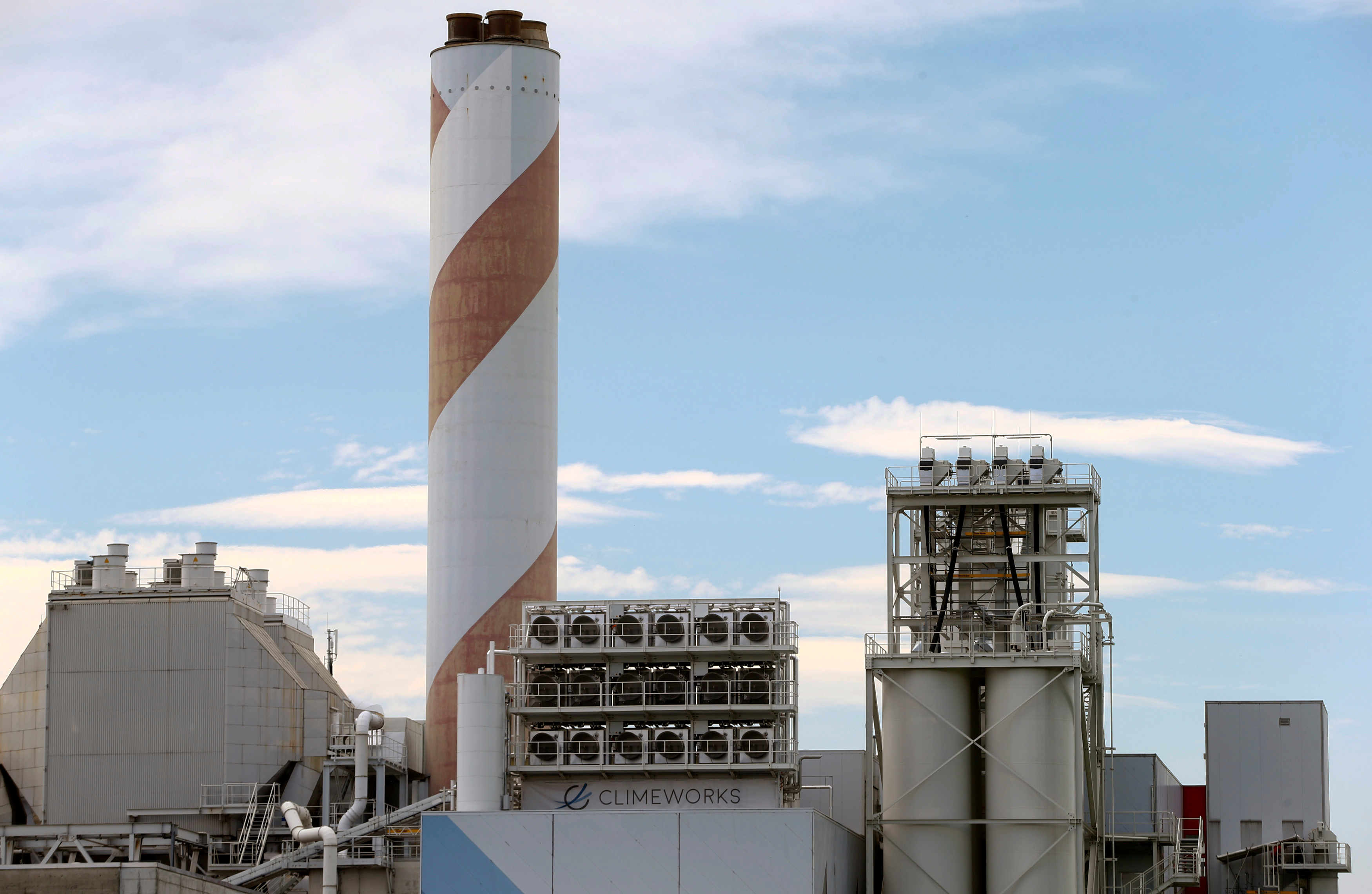 Machinery for capturing CO2 from the air is placed on the roof of a waste incinerating plant in Hinwil, Switzerland [File: Arnd Wiegmann/Reuters]