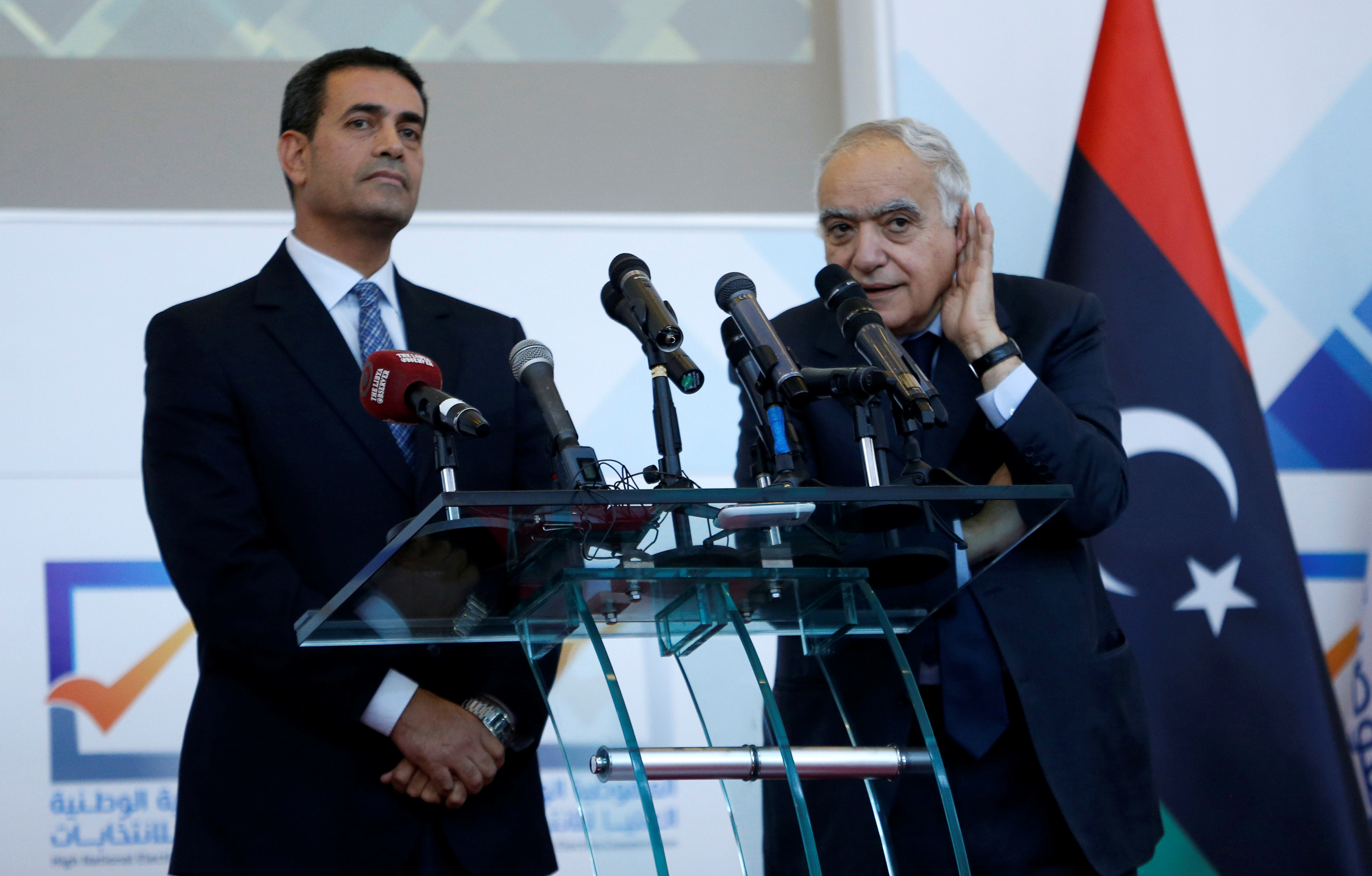 Emad Al-Sayeh, Head of the High National Election Commission, left, said it had received amendments to the law from the parliament [File: Ismail Zitouny/Reuters]
