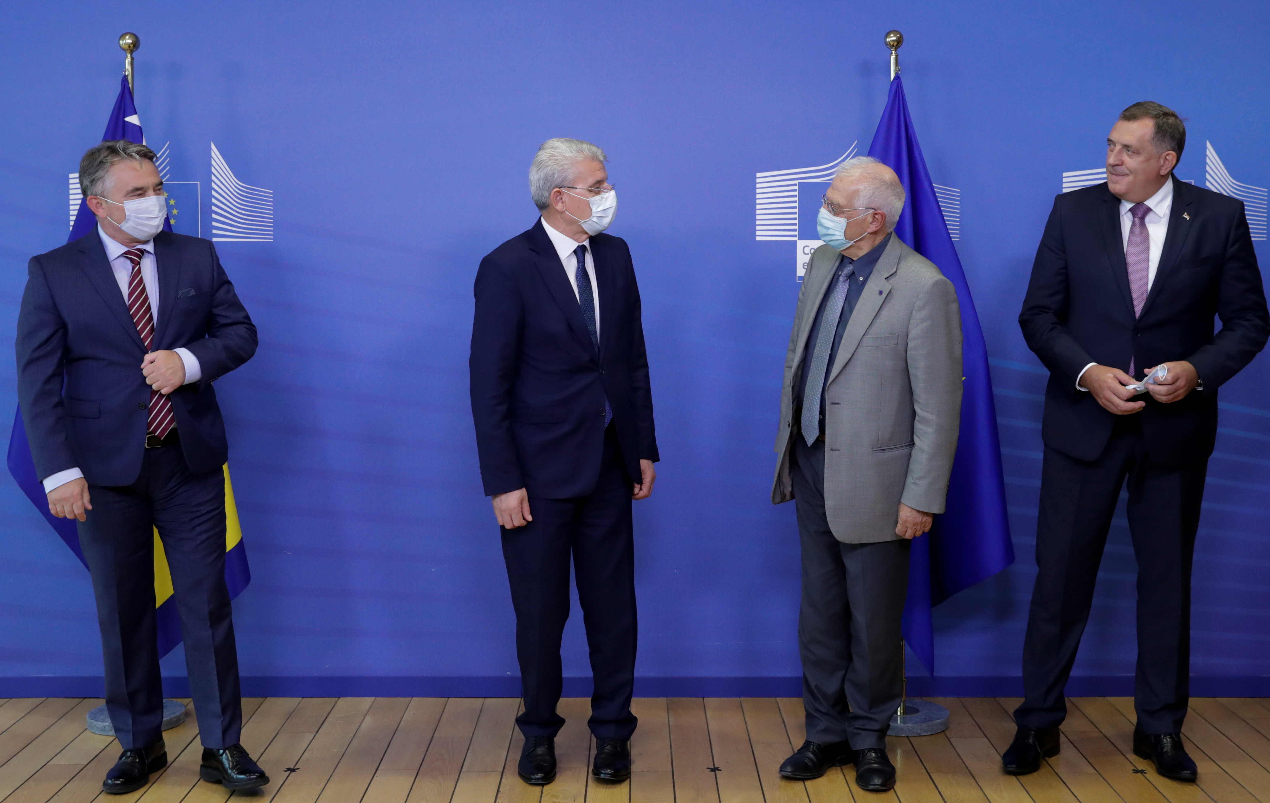 Members of the Presidency of Bosnia and Herzegovina Chairman Šefik Džaferović, Željko Komšić and Milorad Dodik pose with European High Representative of the Union for Foreign Affairs Josep Borrell ahead of a meeting at EU Commission headquarters in Brussels on September 30, 2020 [File: Reuters/Olivier Hoslet]