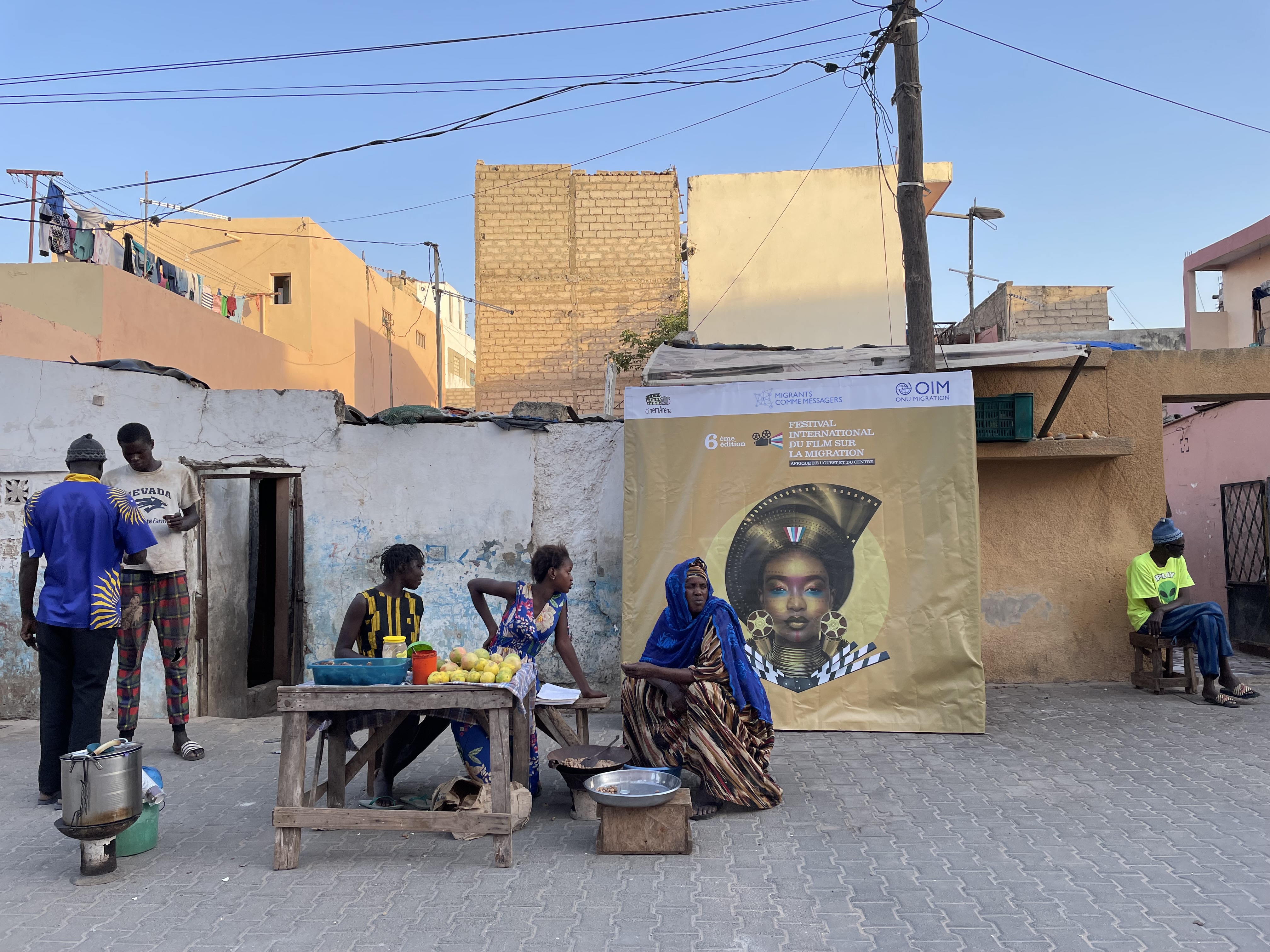 Residents of Dakar's Yaraax neighbourhood pictured ahead of a community screening of Aïssata Ndiaye's Sous Mes Pieds on November 20 [Portia Crowe/Al Jazeera]