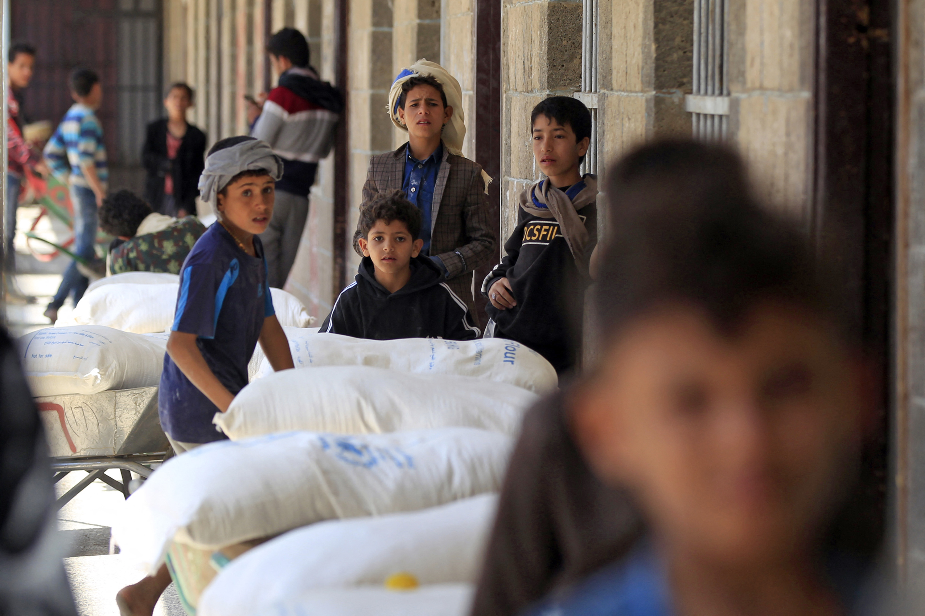 People receiving aid at a warehouse