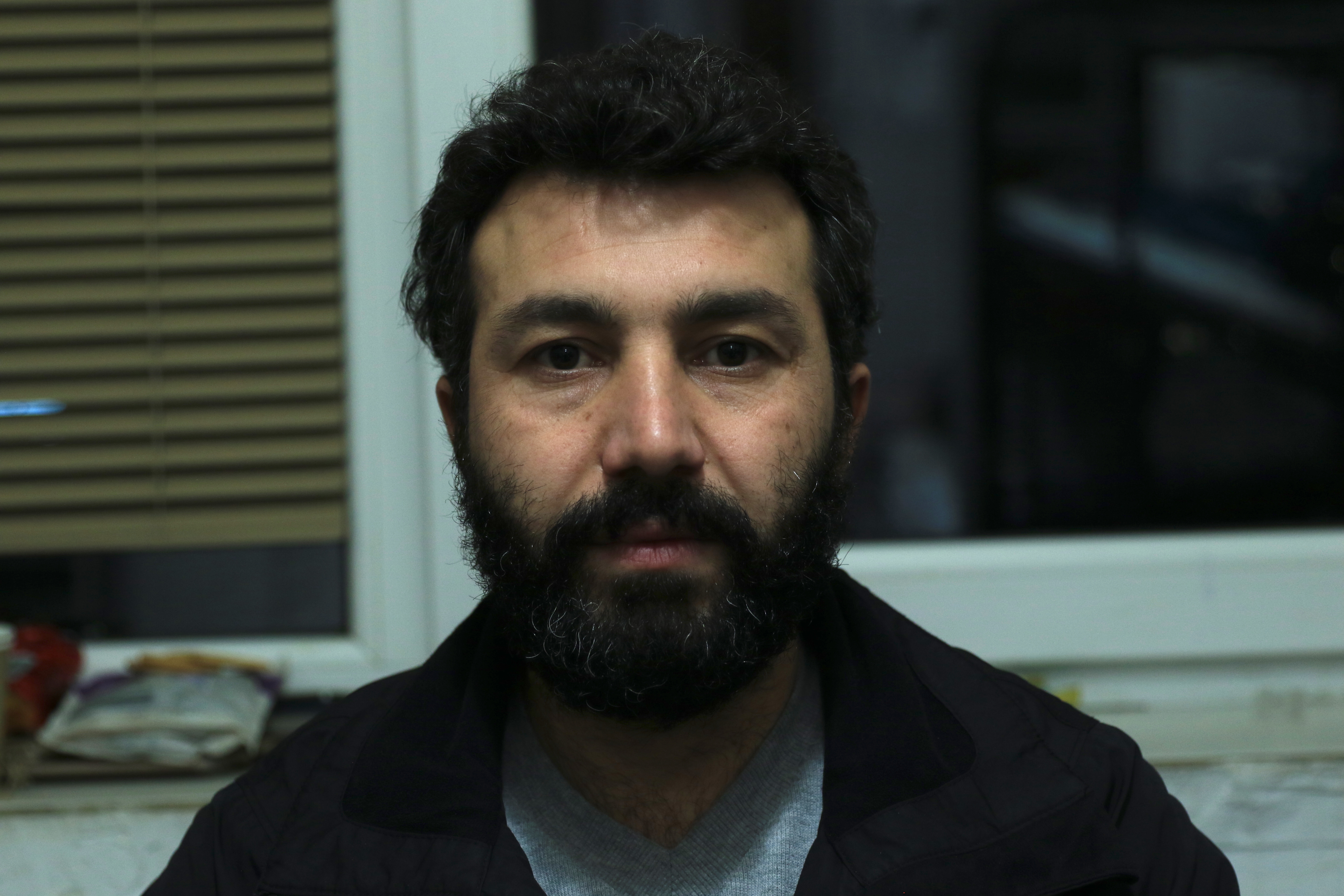 Baravan Huzni Murad, one of many Kurdish Iraqis who have fled to Poland, is grieving after his wife died during the journey [Michal Kranz/Al Jazeera]