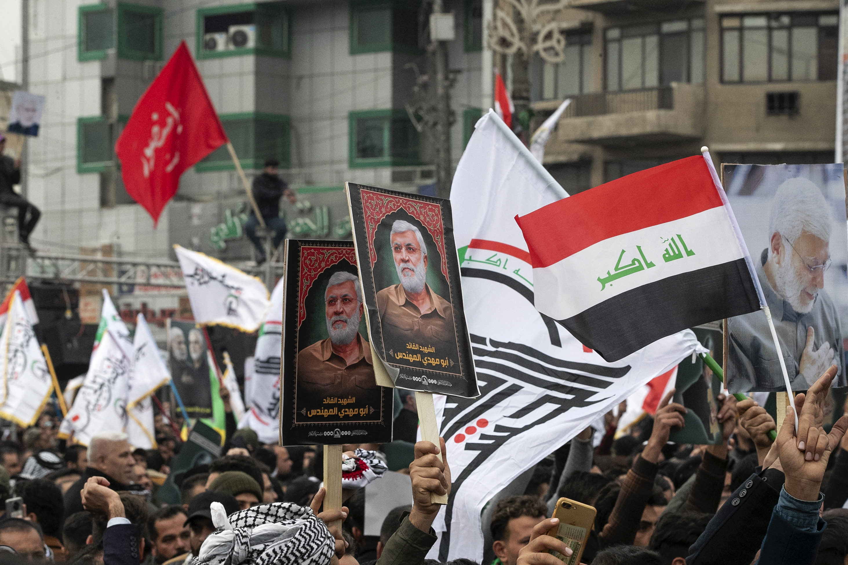 Supporters of Iraq's Hashed al-Shaabi political group rally in Baghdad on the second anniversary of the US assassination of General Qassem Soleimnai