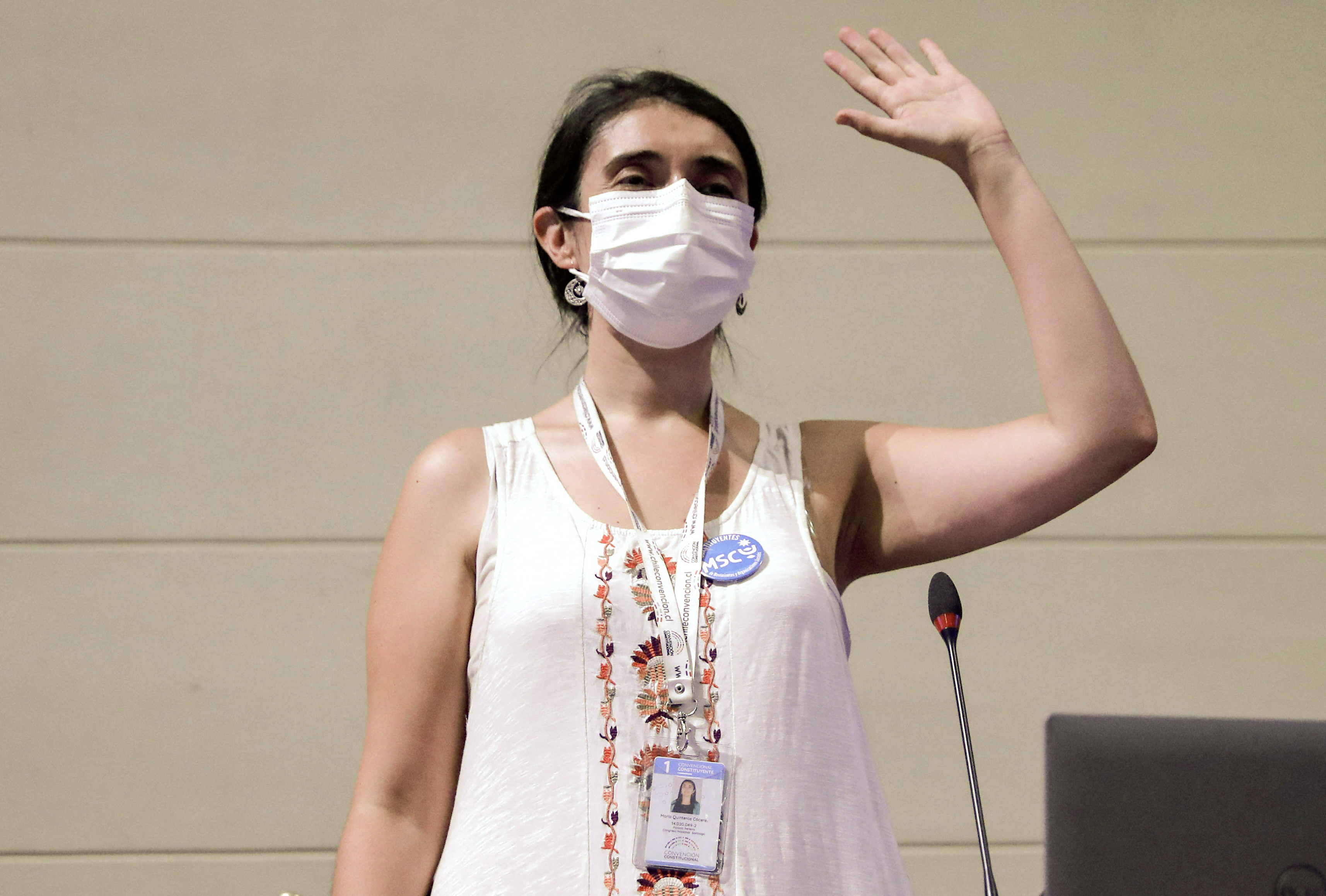 Maria Elisa Quinteros waves after being elected the new president of Chile's constitutional assembly