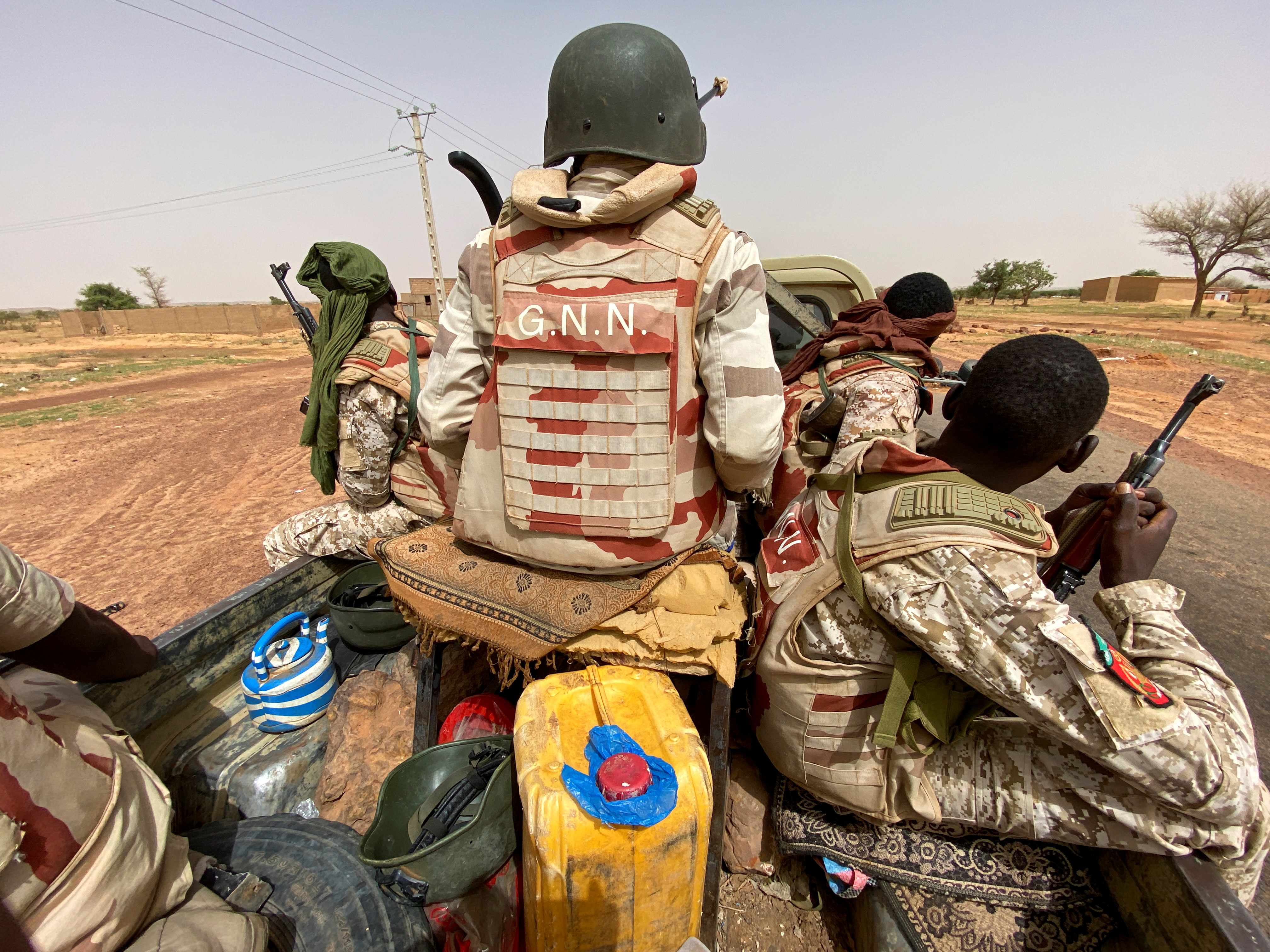 A convoy of Nigerien soldiers on patrol outside the town of Ouallam, Niger
