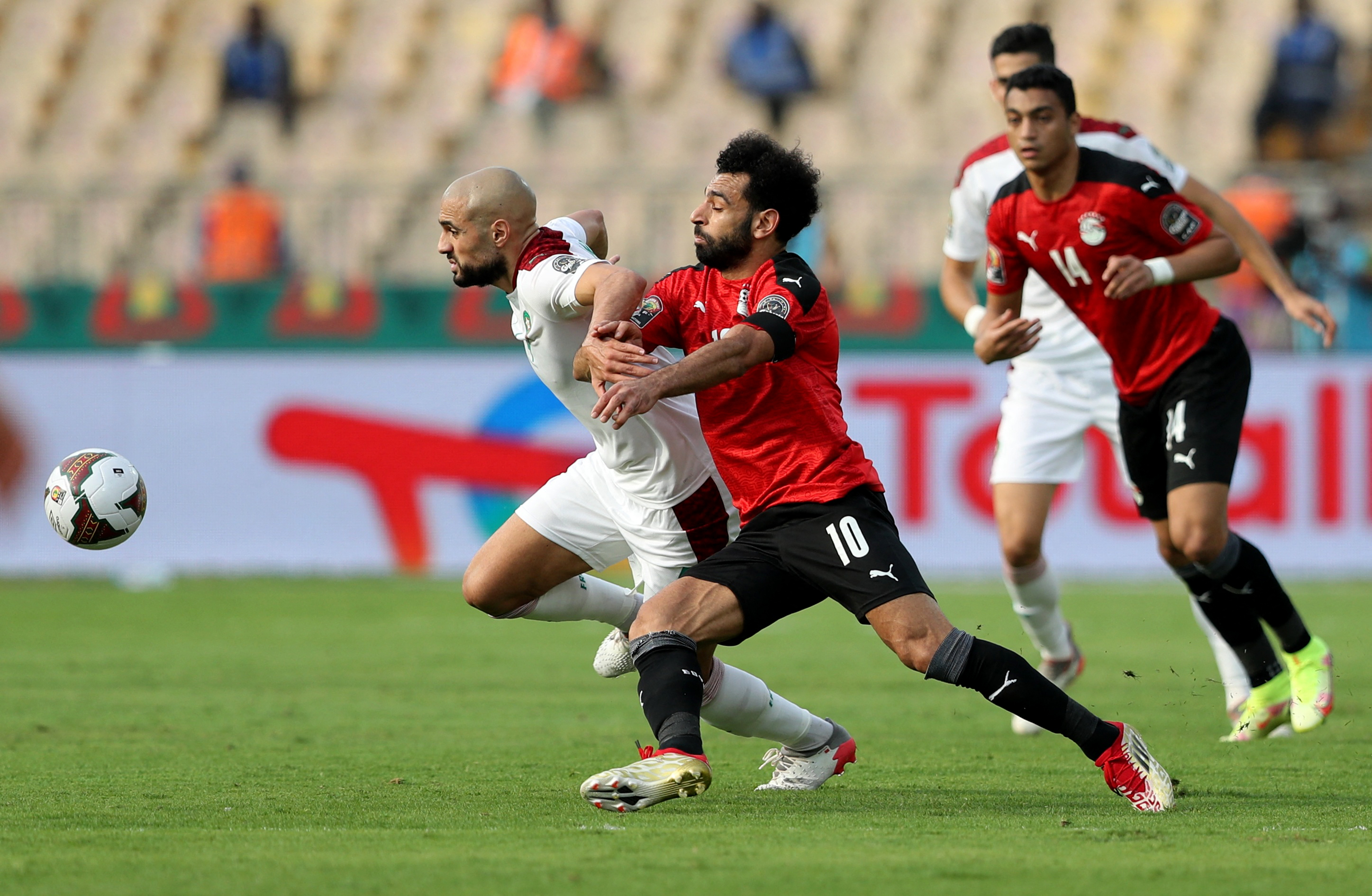 Soccer Football - Africa Cup of Nations - Quarter Final - Egypt v Morocco - Ahmadou Ahidjo Stadium, Yaounde, Cameroon - January 30, 2022 Morocco's Sofyan Amrabat in action with Egypt's Mohamed Salah REUTERS/Mohamed Abd El Ghany