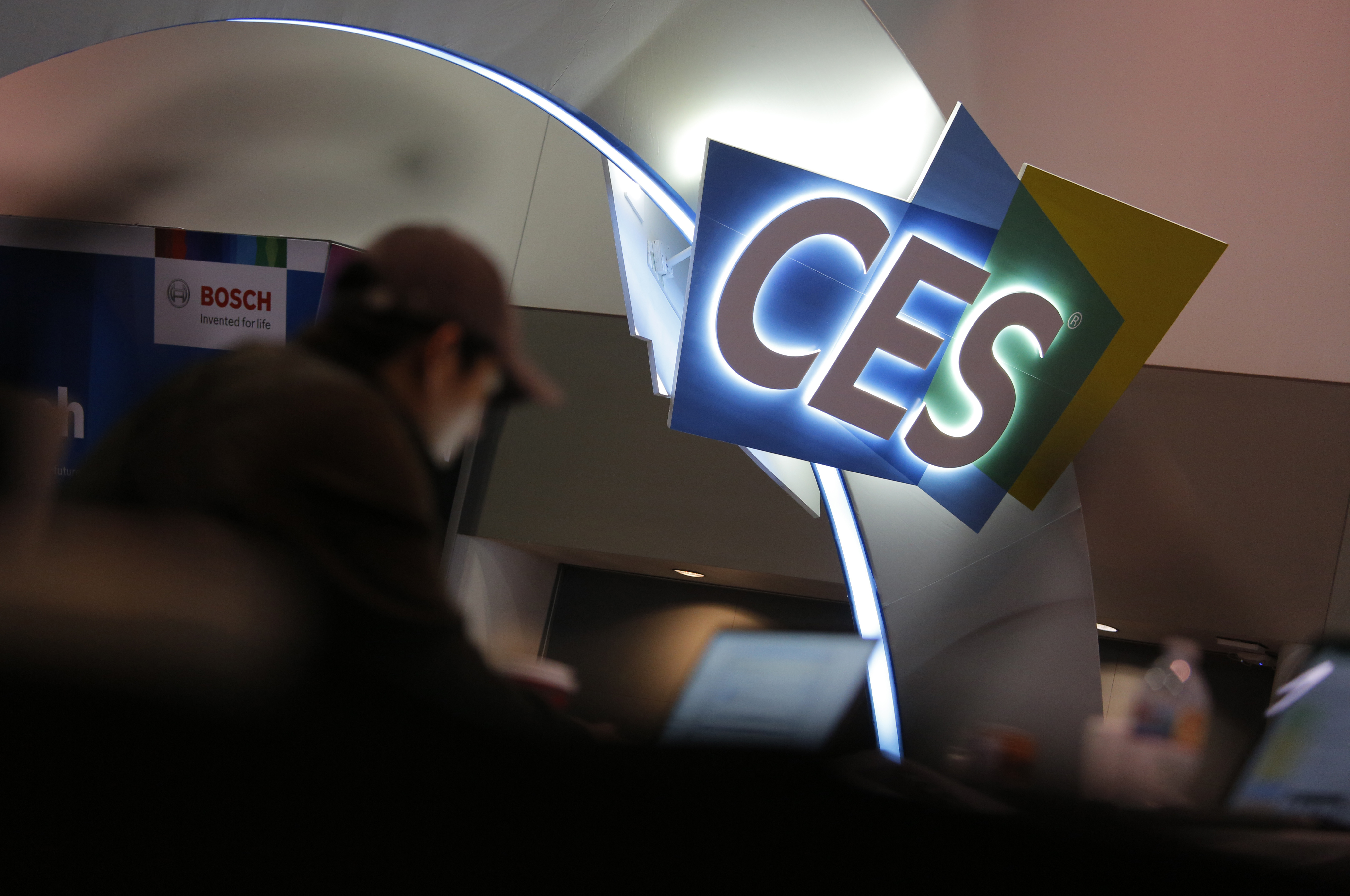 A worker helps set up a booth before CES International in January 2020