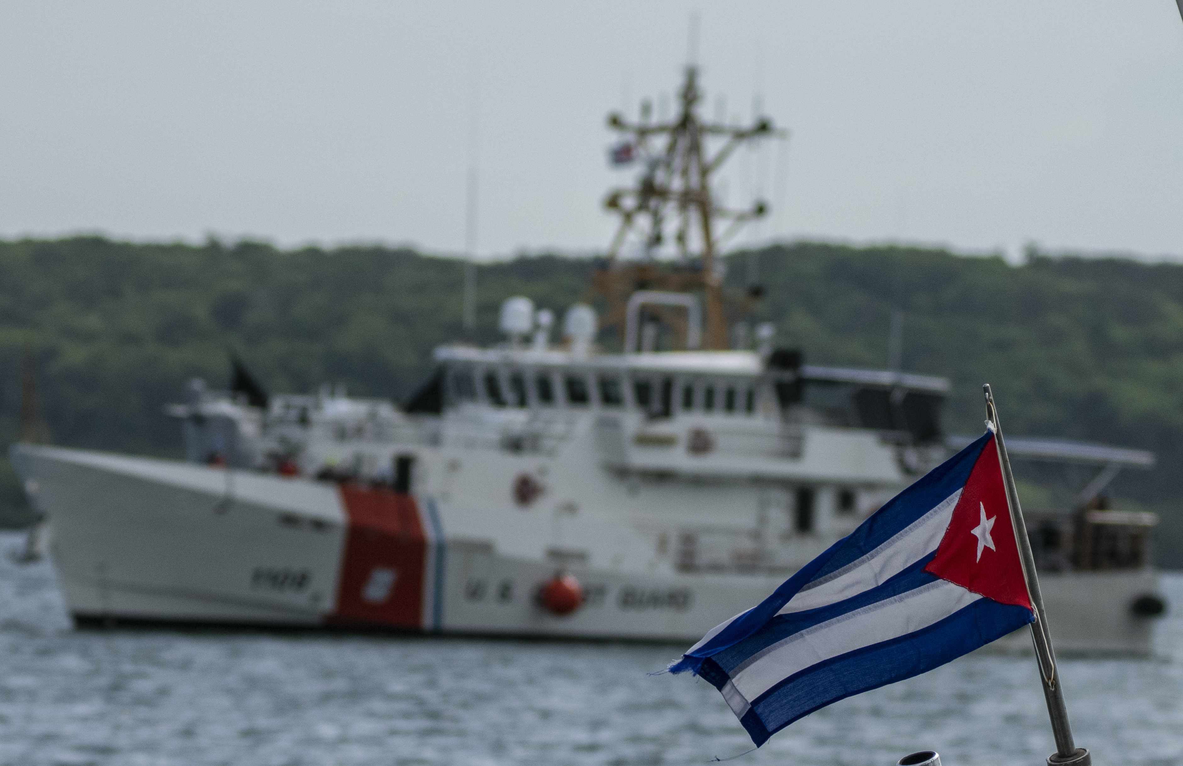 Cuban flag and boat in the background