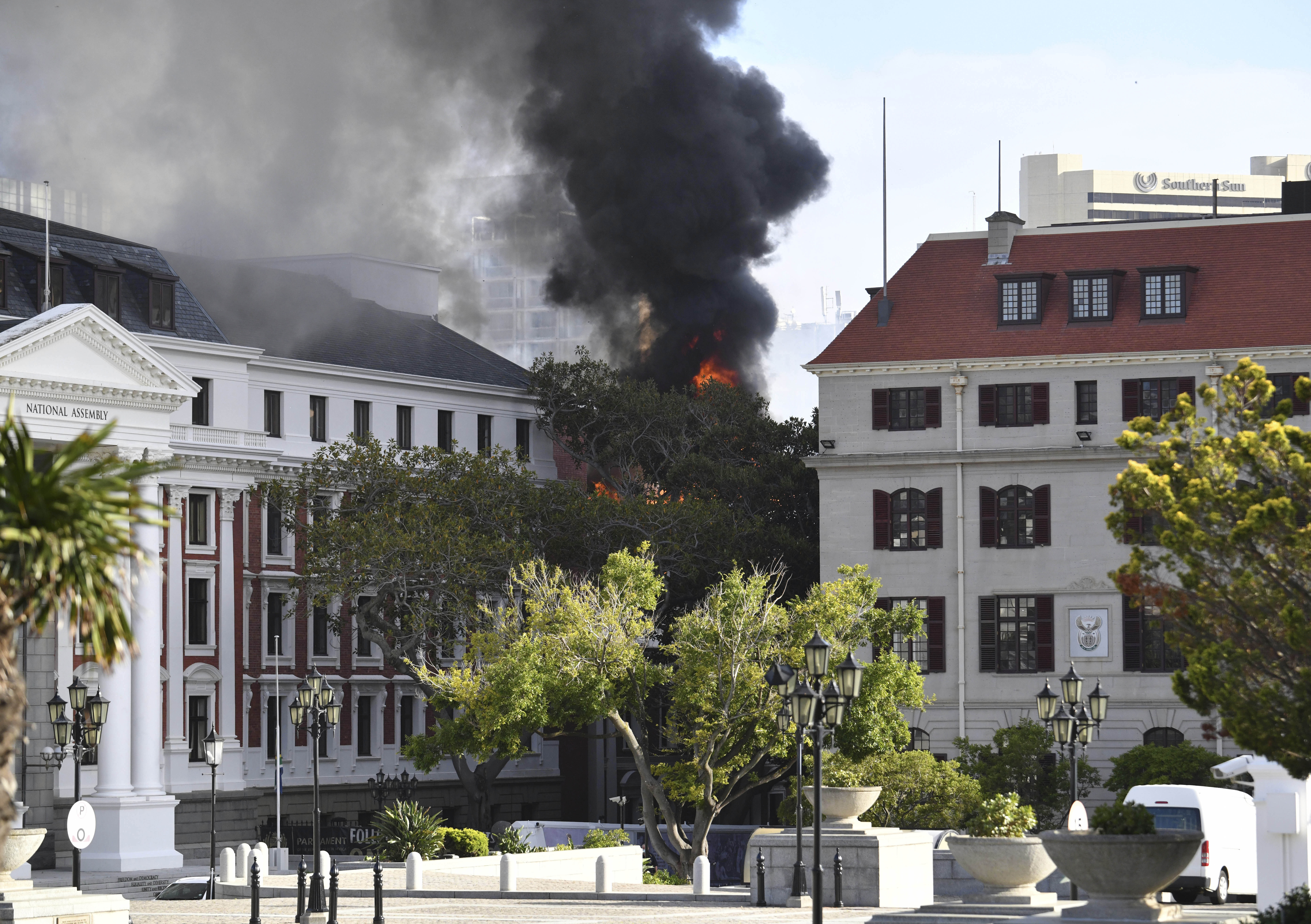 Fire burns at the Houses of Parliament, in Cape Town