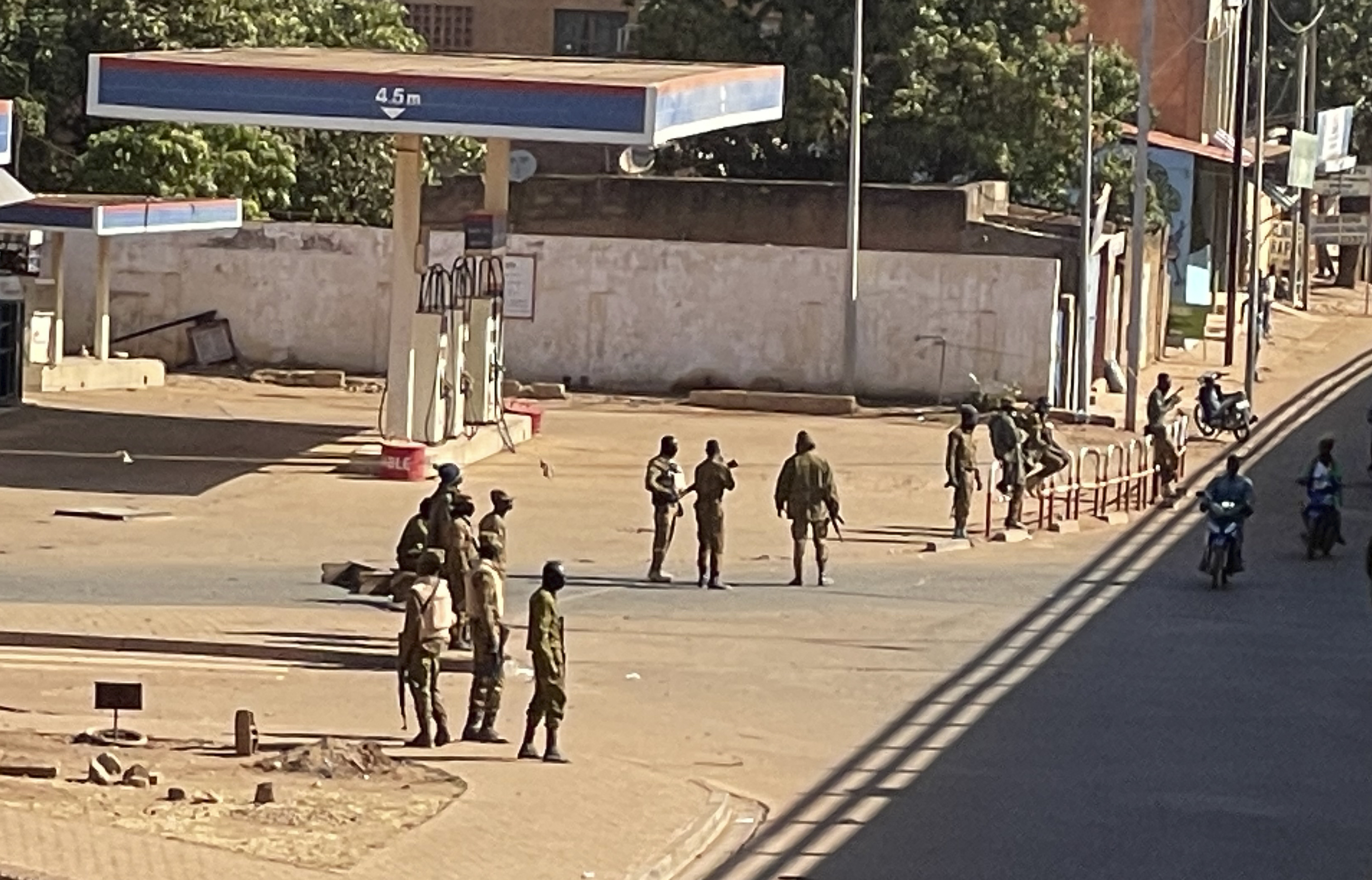 Soldiers stand outside a military base in Burkina Faso's capital Ouagadougou