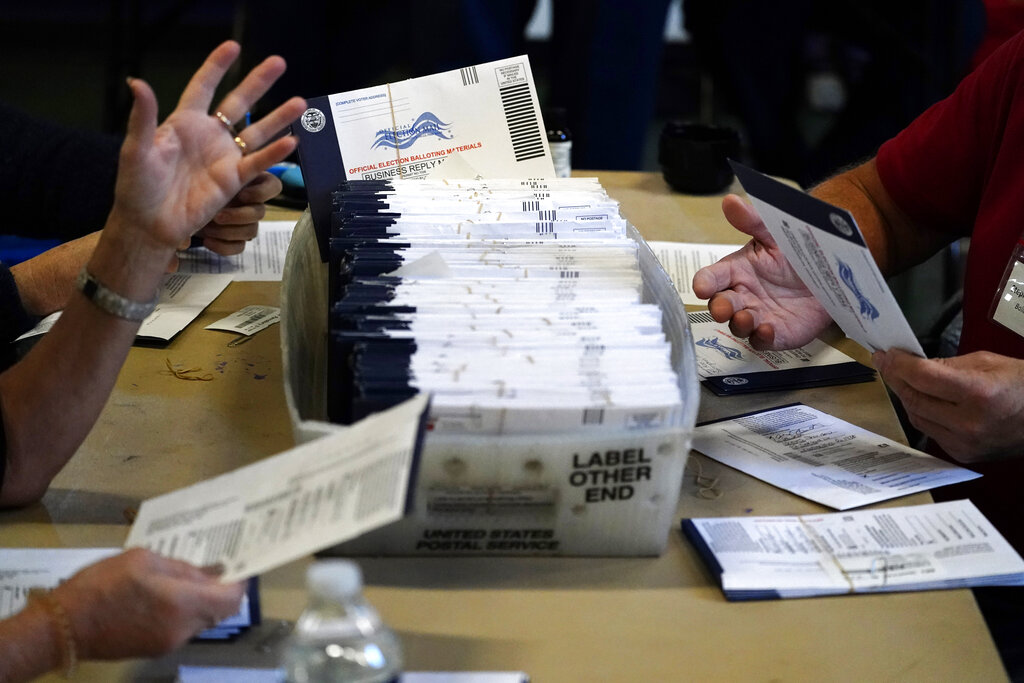 Chester County election workers process mail-in and absentee ballots for the 2020 general election.